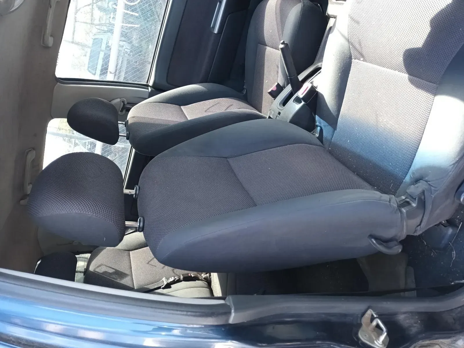 Dark Gray Car Interior With Front and Back Seats Visible — South West 4WD Wreckers In Brisbane, QLD