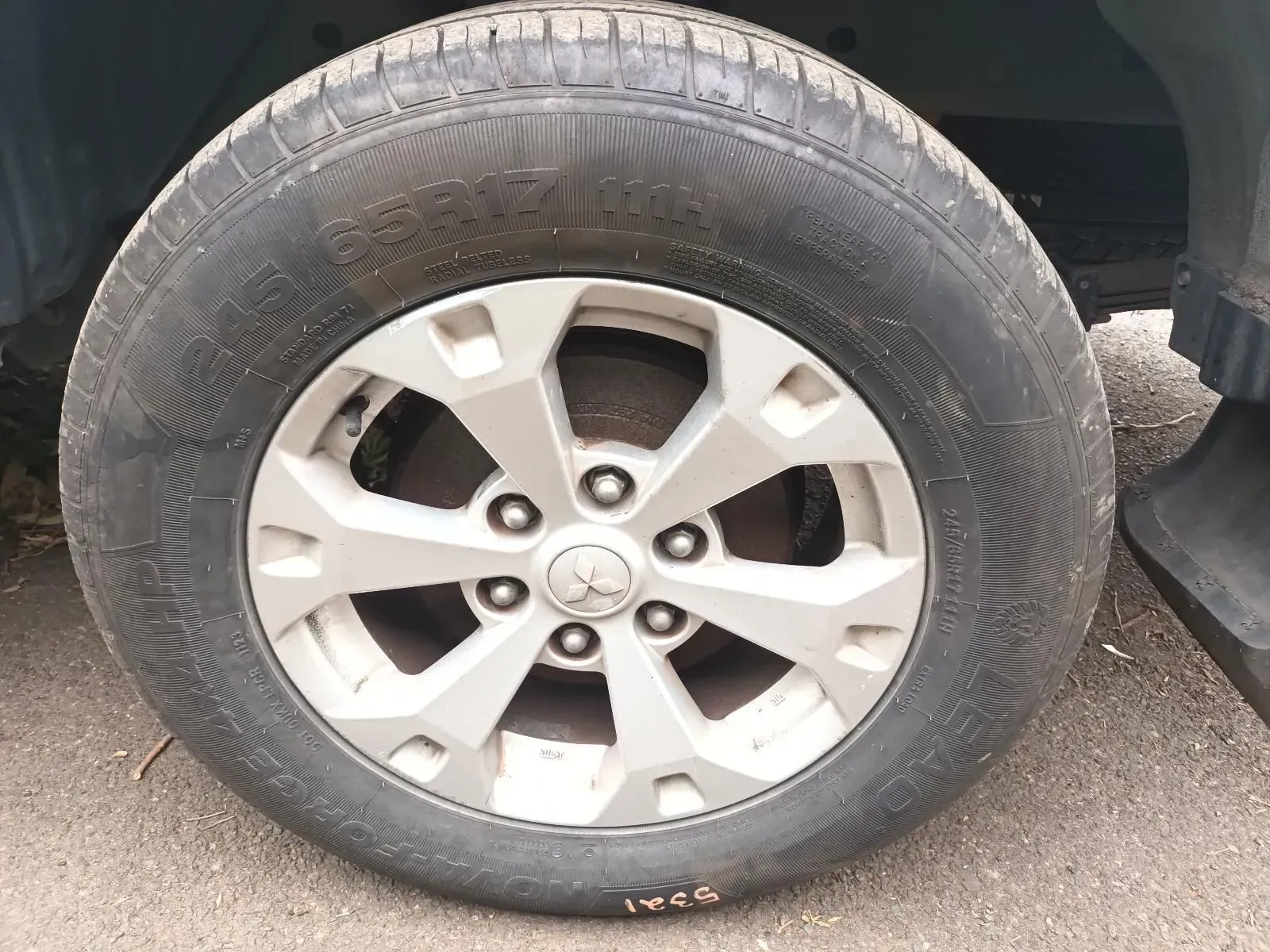 Car Tyre With a Silver Rim, Showing Tread Pattern and the Vehicle's Mechanics — South West 4WD Wreckers In Brisbane, QLD