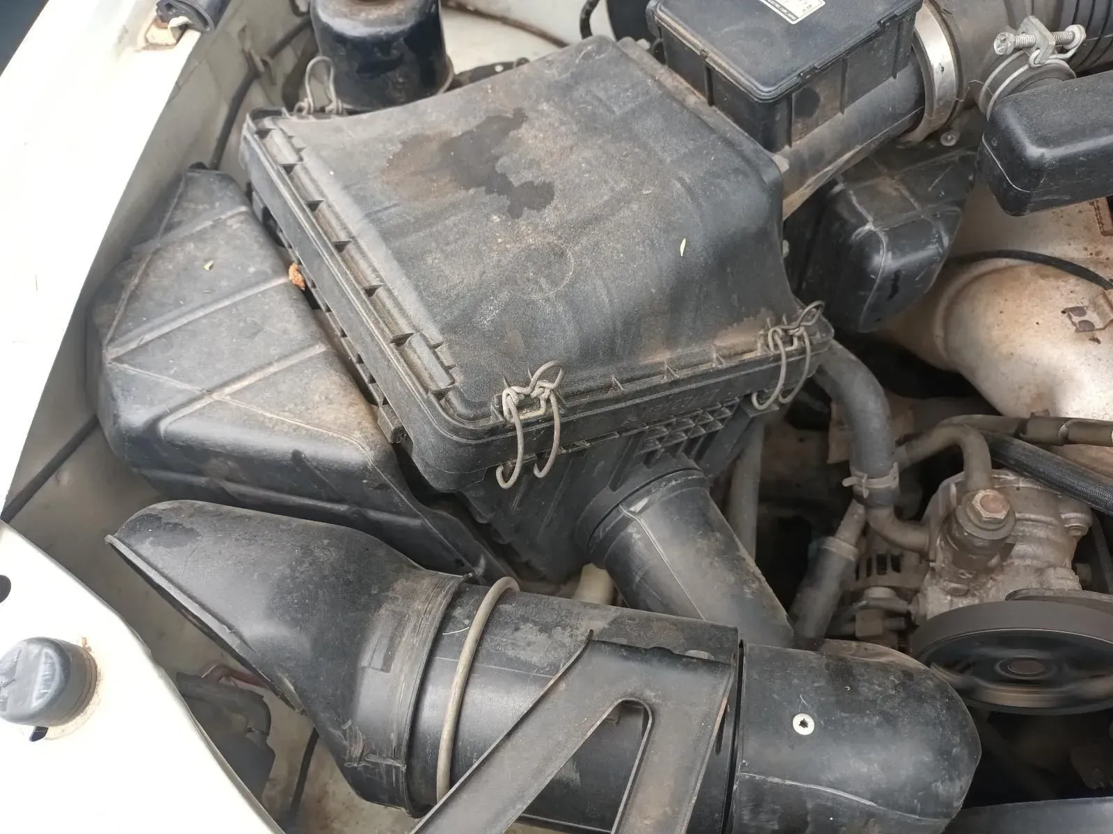 Black Air Filter Box in an Engine Bay, With Connecting Tubes and Clips — South West 4WD Wreckers In Brisbane, QLD