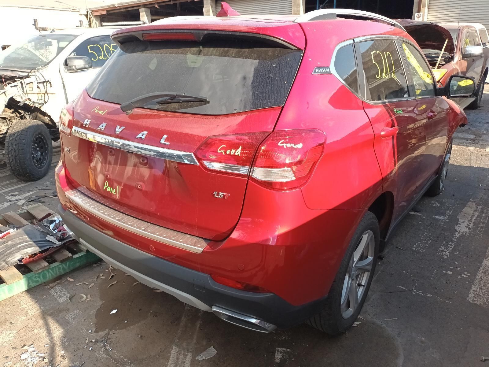 A Red Car is Sitting in a Parking Lot — South West 4WD Wreckers in Harristown, QLD