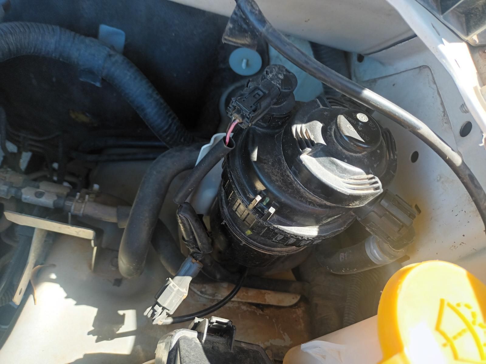 A Close Up of a Car Engine With a Yellow Bottle of Oil — South West 4WD Wreckers In Brisbane, QLD