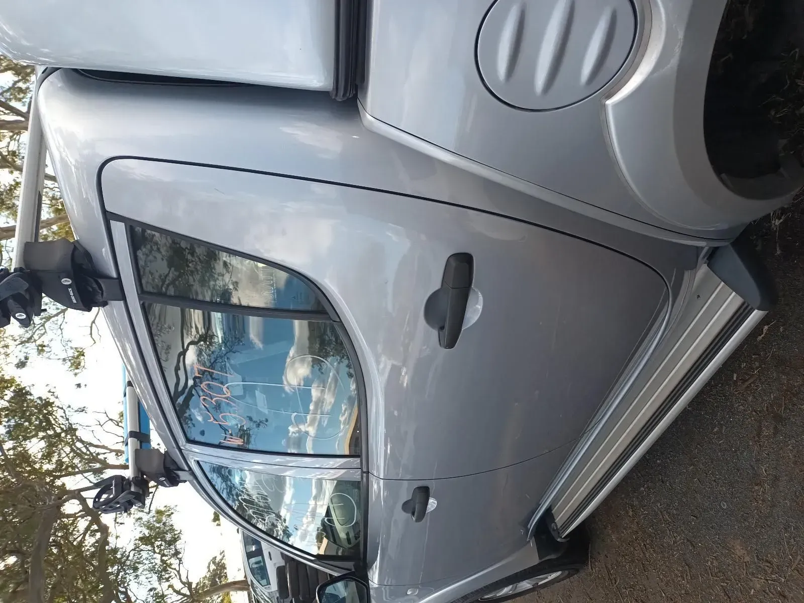 Silver Pickup Truck With Side Steps, Visible Door Handle, and Rack on the Cab — South West 4WD Wreckers In Brisbane, QLD
