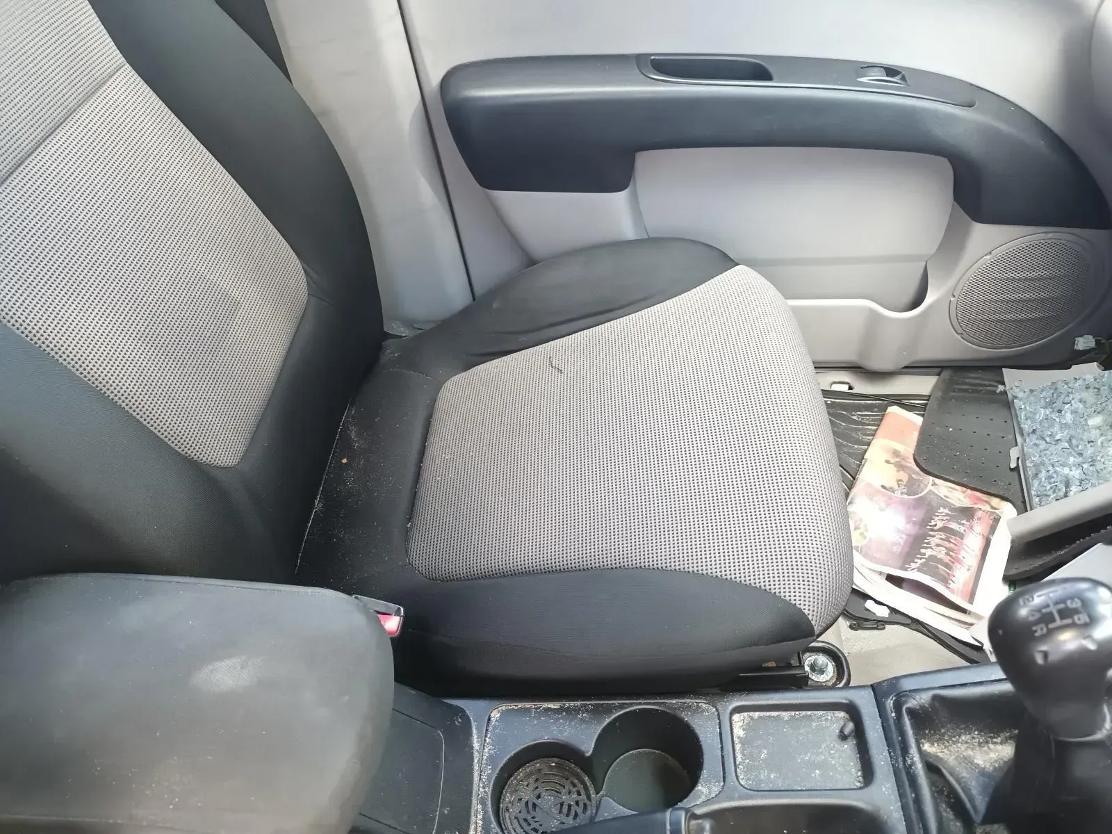 Car Interior: Gray and Black Patterned Seat, Console With Cup Holders — South West 4WD Wreckers In Brisbane, QLD