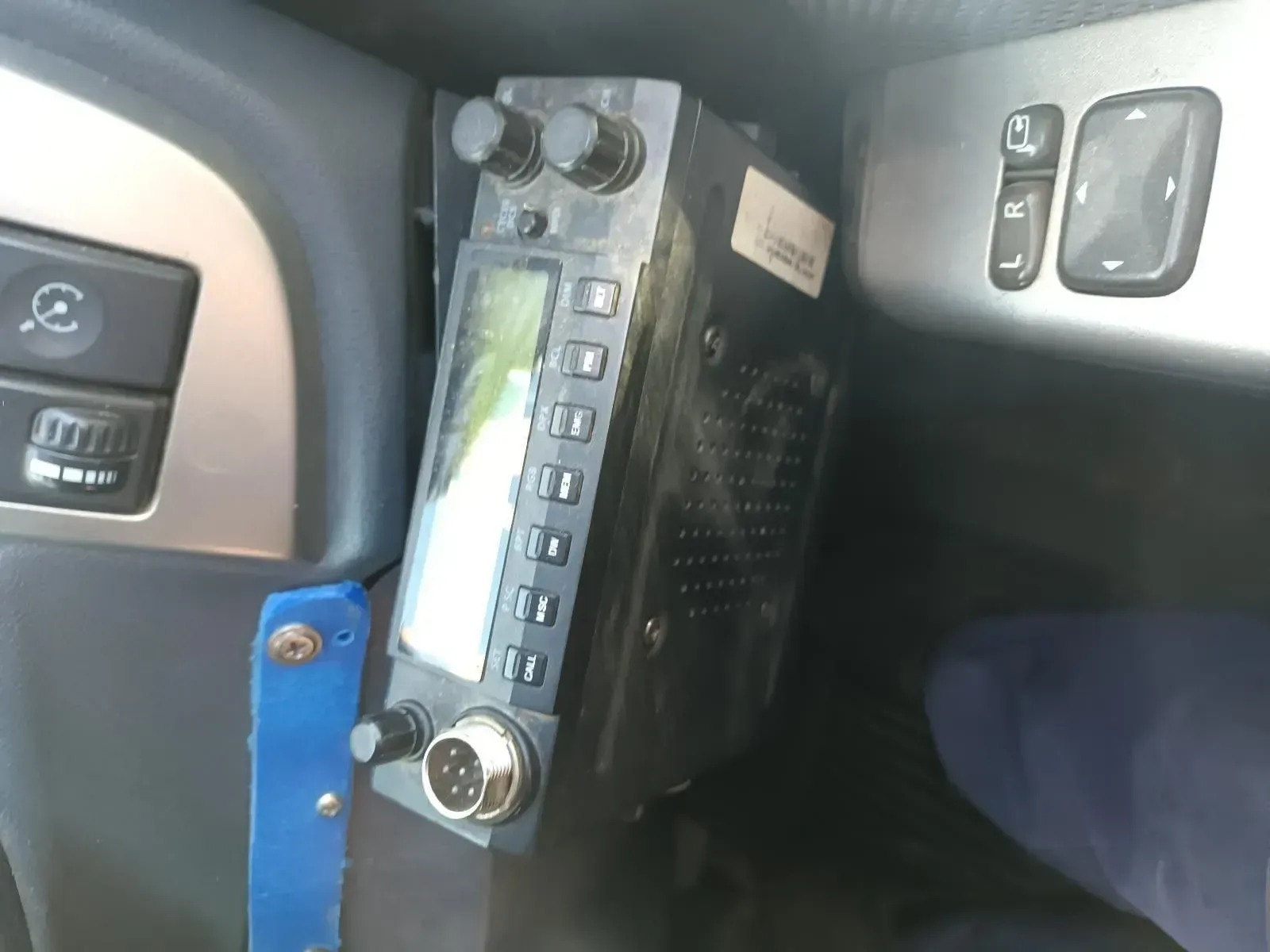Black Radio Mounted Inside a Car's Dashboard With a Blue Strap — South West 4WD Wreckers In Brisbane, QLD