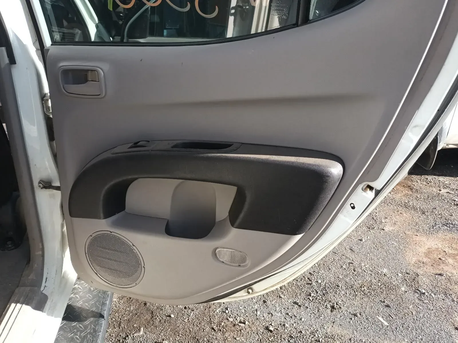 Interior View of a Car Door With a Speaker, Handle, and Gray and Black Paneling — South West 4WD Wreckers In Brisbane, QLD