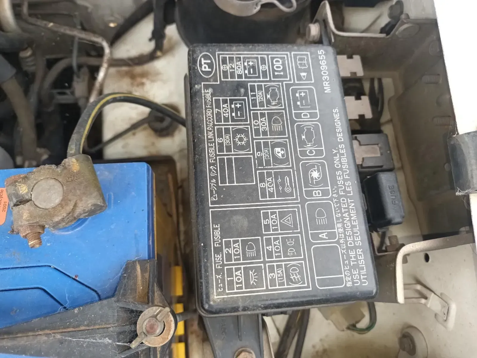 Engine Compartment With Fuse Box and Car Battery — South West 4WD Wreckers In Brisbane, QLD