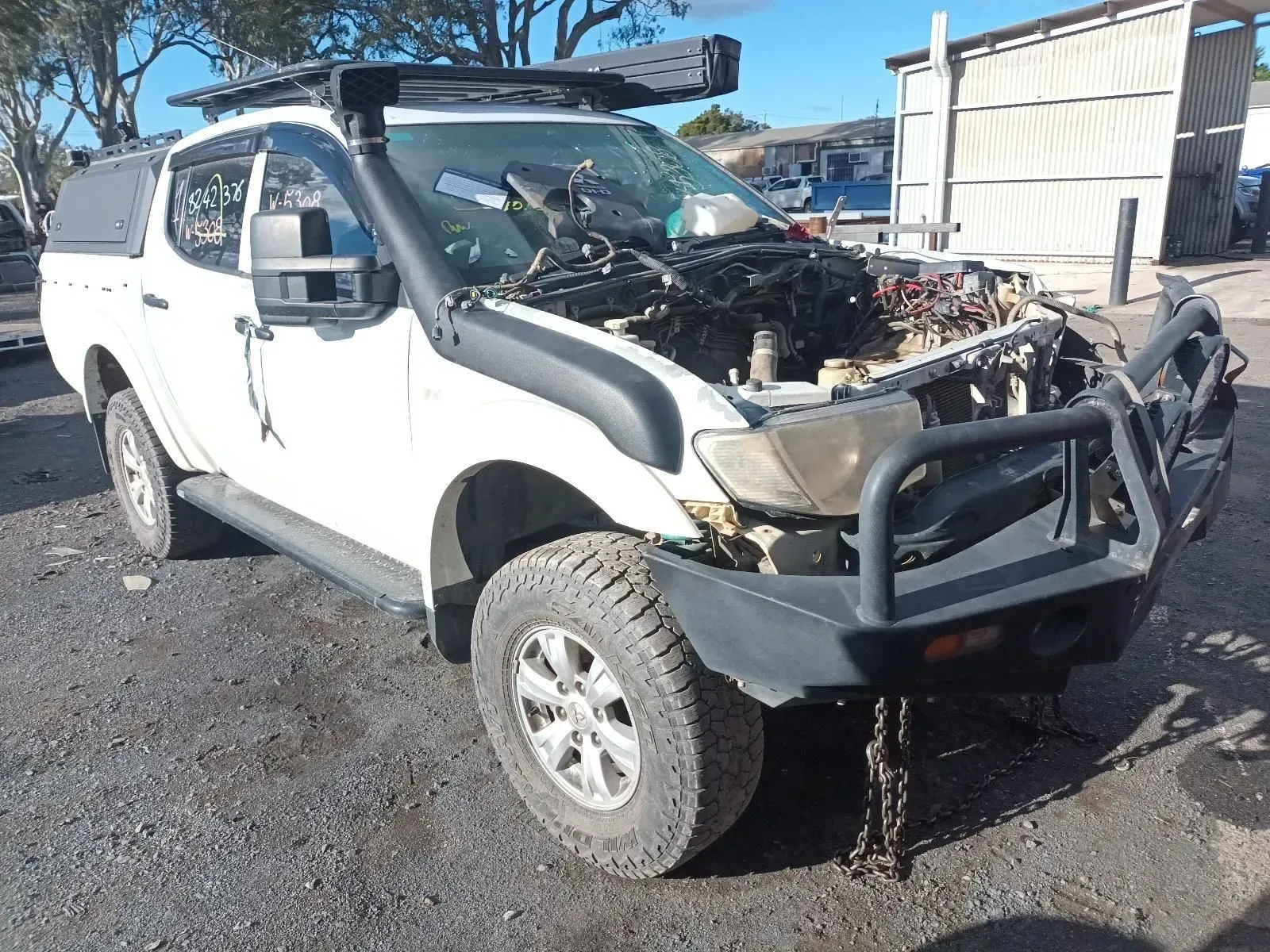 White Pickup Truck Missing Engine and Parts at a Junkyard — South West 4WD Wreckers In Brisbane, QLD