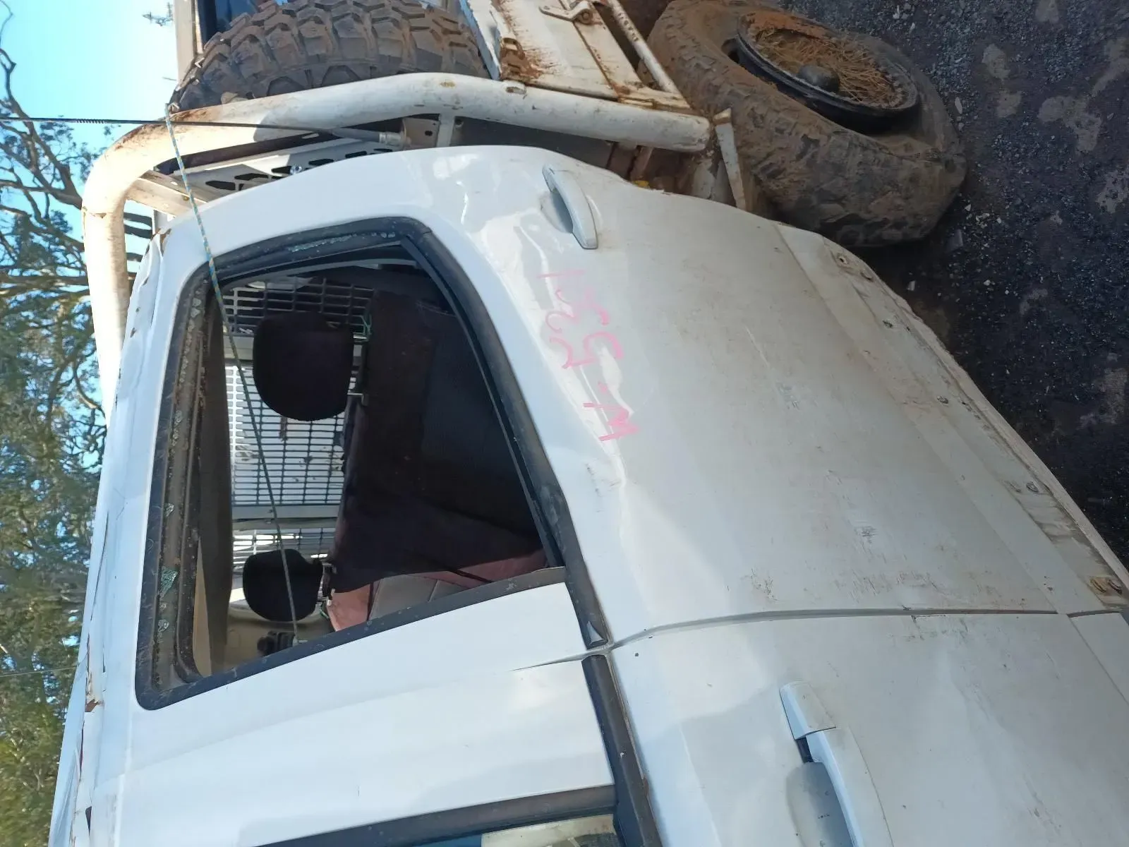 White Truck With Roll Cage, Side View, Weathered, Parked Outdoors — South West 4WD Wreckers In Brisbane, QLD