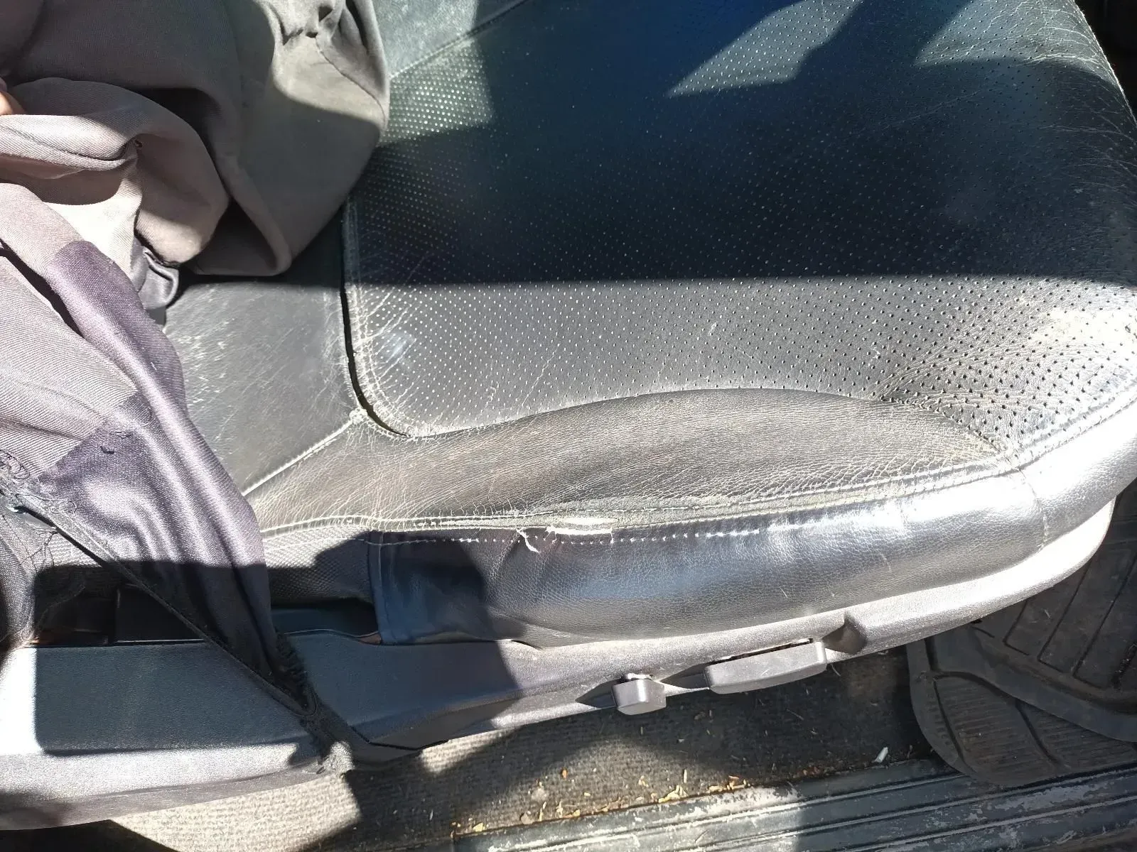 Black Leather Car Seat With Wear and Tear — South West 4WD Wreckers In Brisbane, QLD