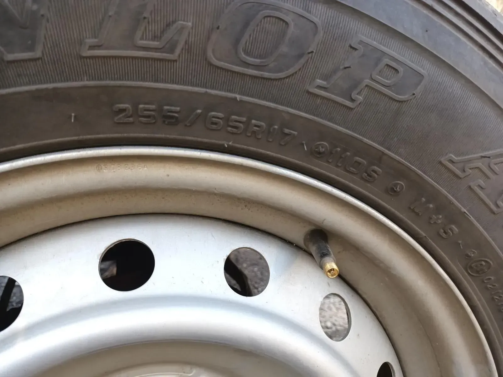 Close-up of a Tyre Showing Tyre Size 255/65r17 on a Silver Steel Wheel — South West 4WD Wreckers In Brisbane, QLD