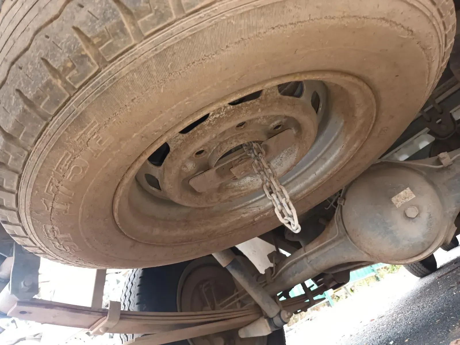 Spare Tyre Mounted Under a Pickup Truck, Covered in Dirt — South West 4WD Wreckers In Brisbane, QLD