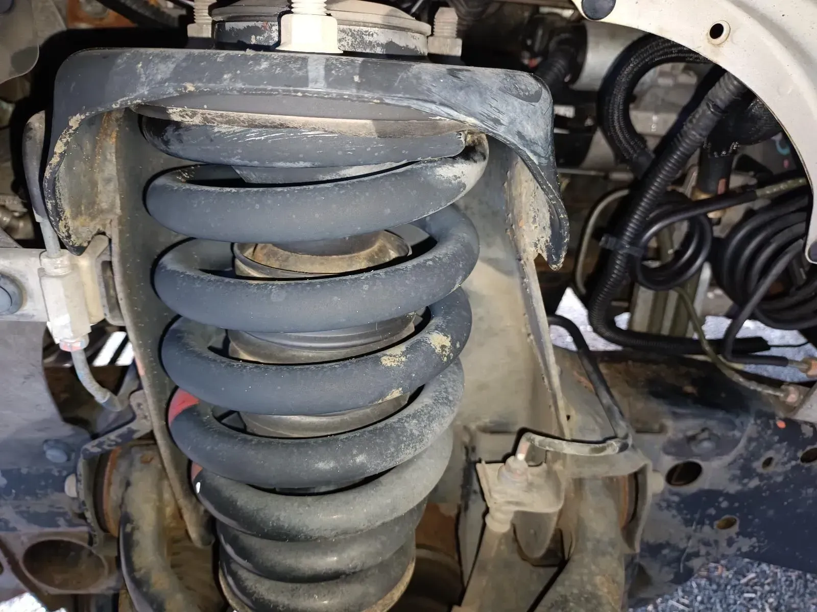 Suspension Coil Spring on a Vehicle, Viewed From Below — South West 4WD Wreckers In Brisbane, QLD
