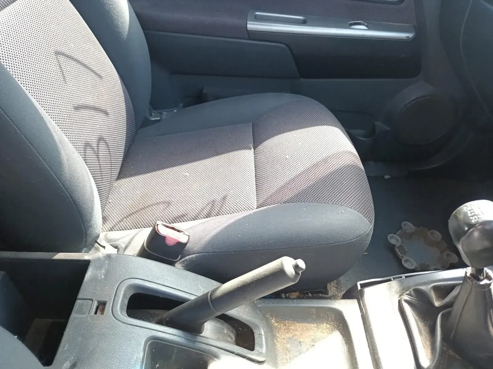 Car Interior: Driver's Seat, Center Console With Handbrake and Gear Shift — South West 4WD Wreckers In Brisbane, QLD