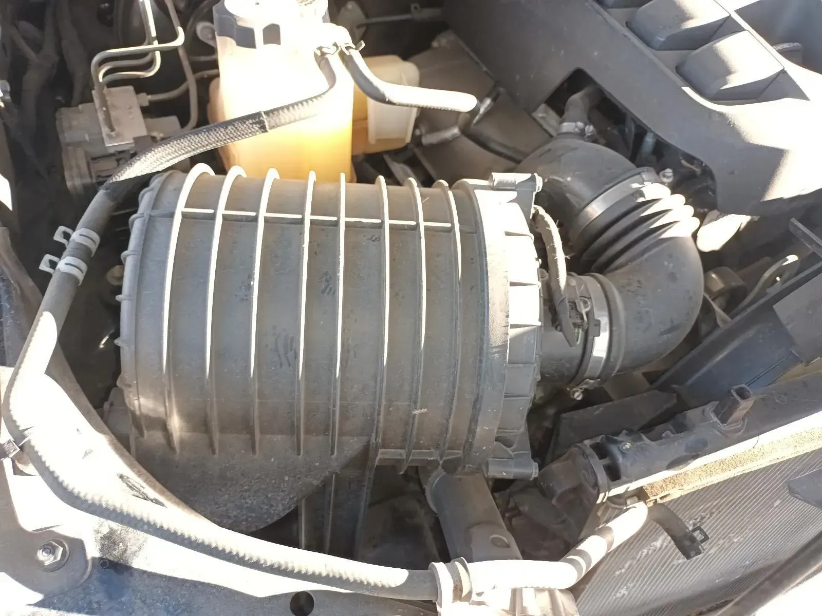 Engine Compartment With Black Air Filter Housing and Connecting Tubes — South West 4WD Wreckers In Brisbane, QLD