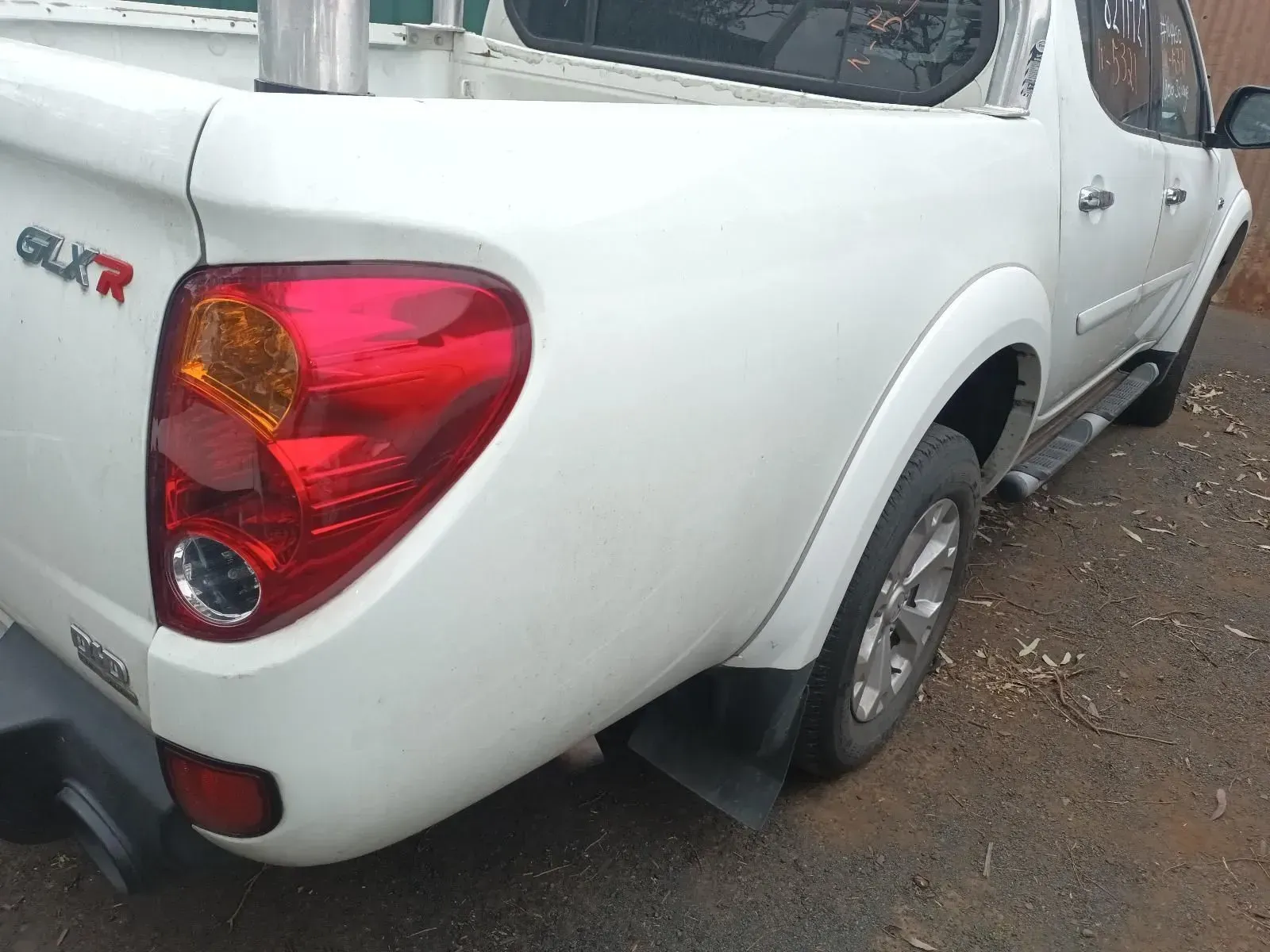 White Pickup Truck, Rear View, Taillight Visible, Outdoors — South West 4WD Wreckers In Brisbane, QLD