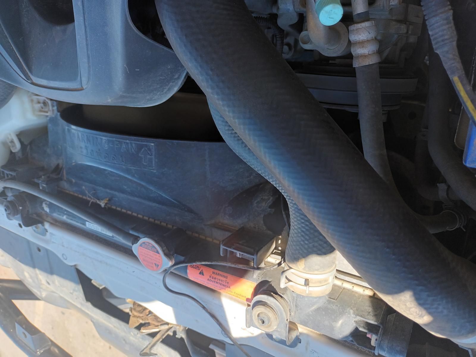 A Close Up of a Car Engine With a Hose Attached to It — South West 4WD Wreckers In Brisbane, QLD