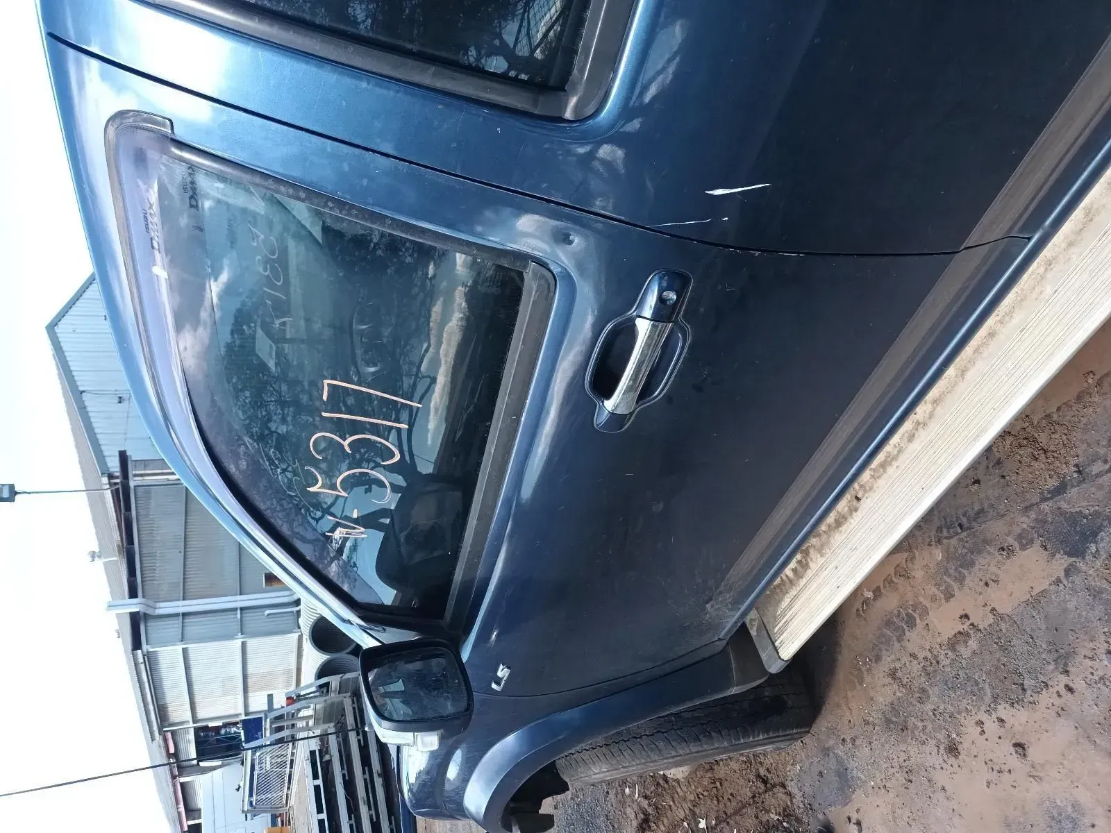 Blue Car Door With a Handle, in a Junkyard — South West 4WD Wreckers In Brisbane, QLD