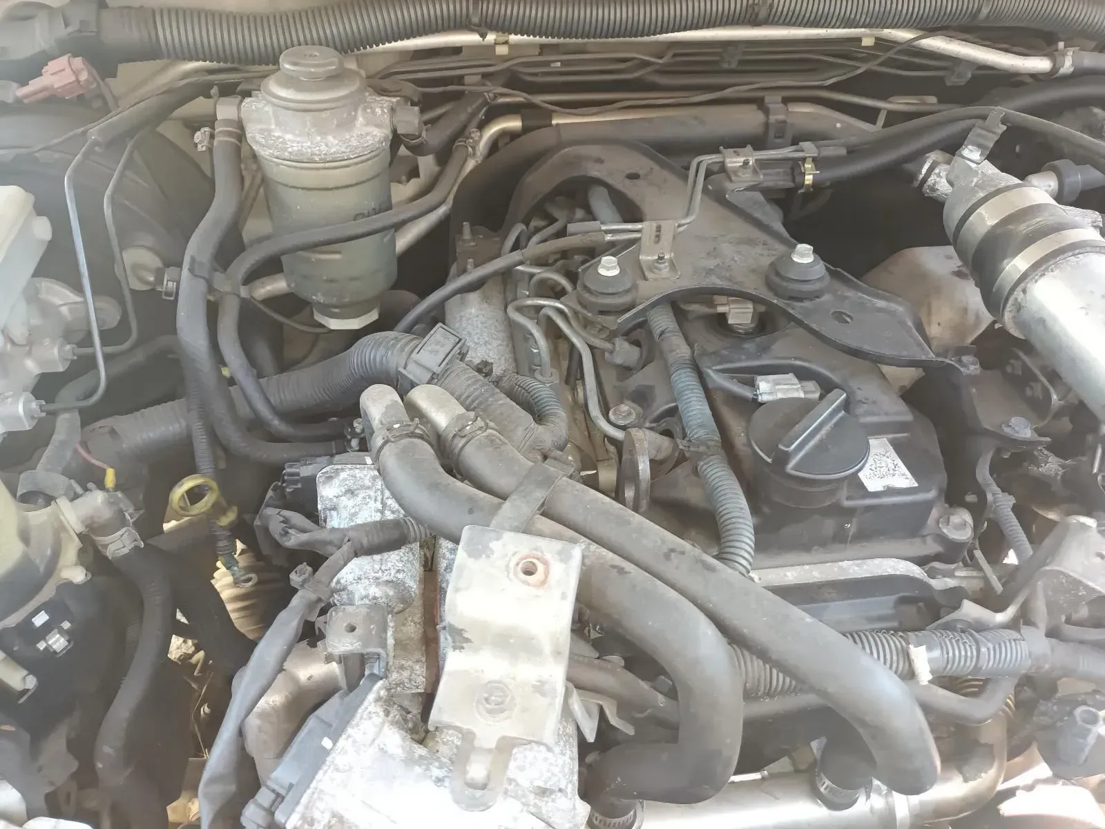 Engine Compartment With Hoses, Wires, and a Fluid Reservoir — South West 4WD Wreckers In Brisbane, QLD