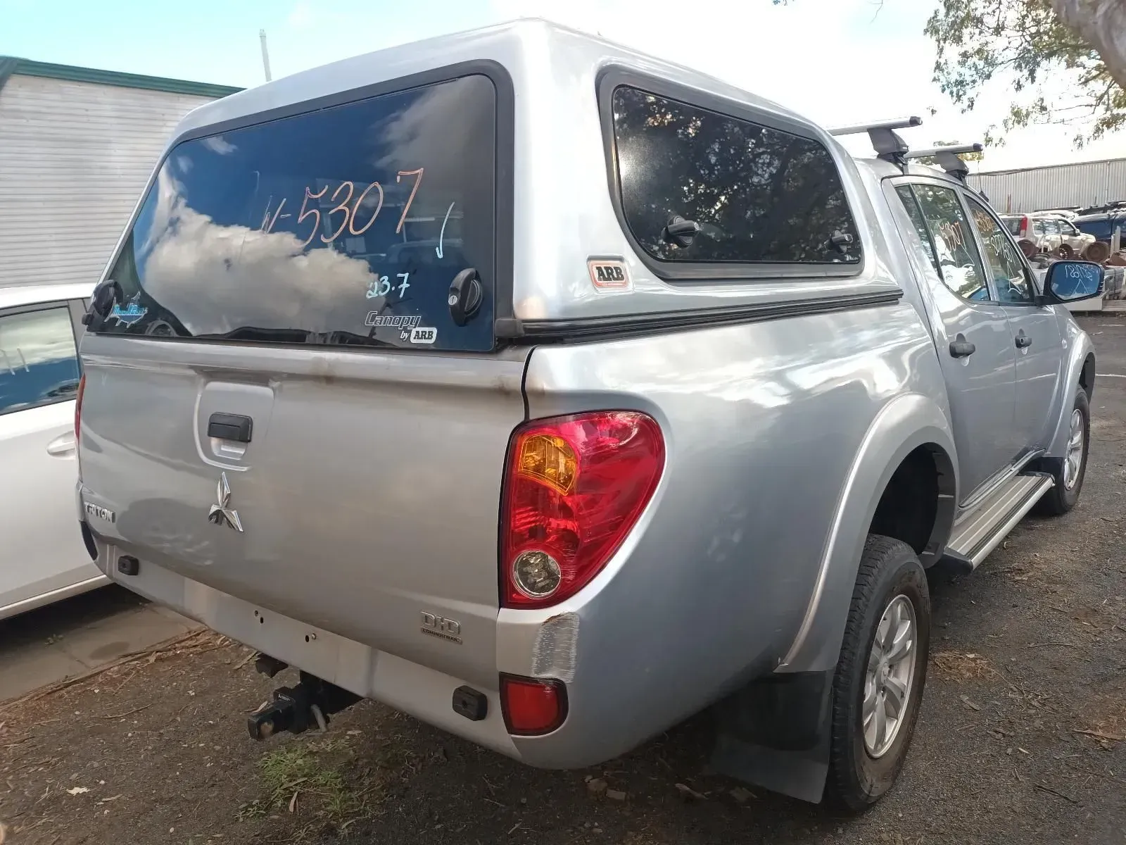Silver Mitsubishi Pickup Truck With a Canopy in an Outdoor Setting — South West 4WD Wreckers In Brisbane, QLD