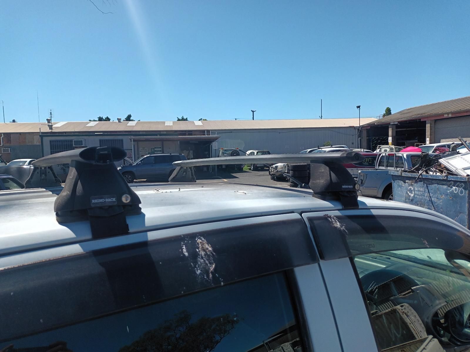 A Silver Car With a Roof Rack on Top of It — South West 4WD Wreckers In Brisbane, QLD