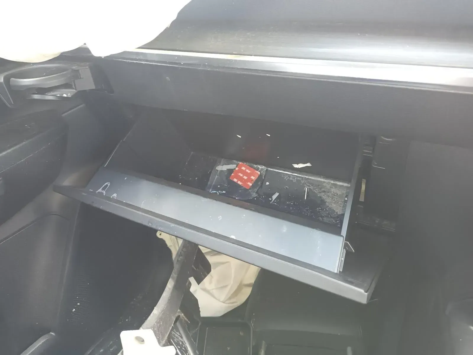 Open Car Glove Compartment With Items Inside — South West 4WD Wreckers In Brisbane, QLD