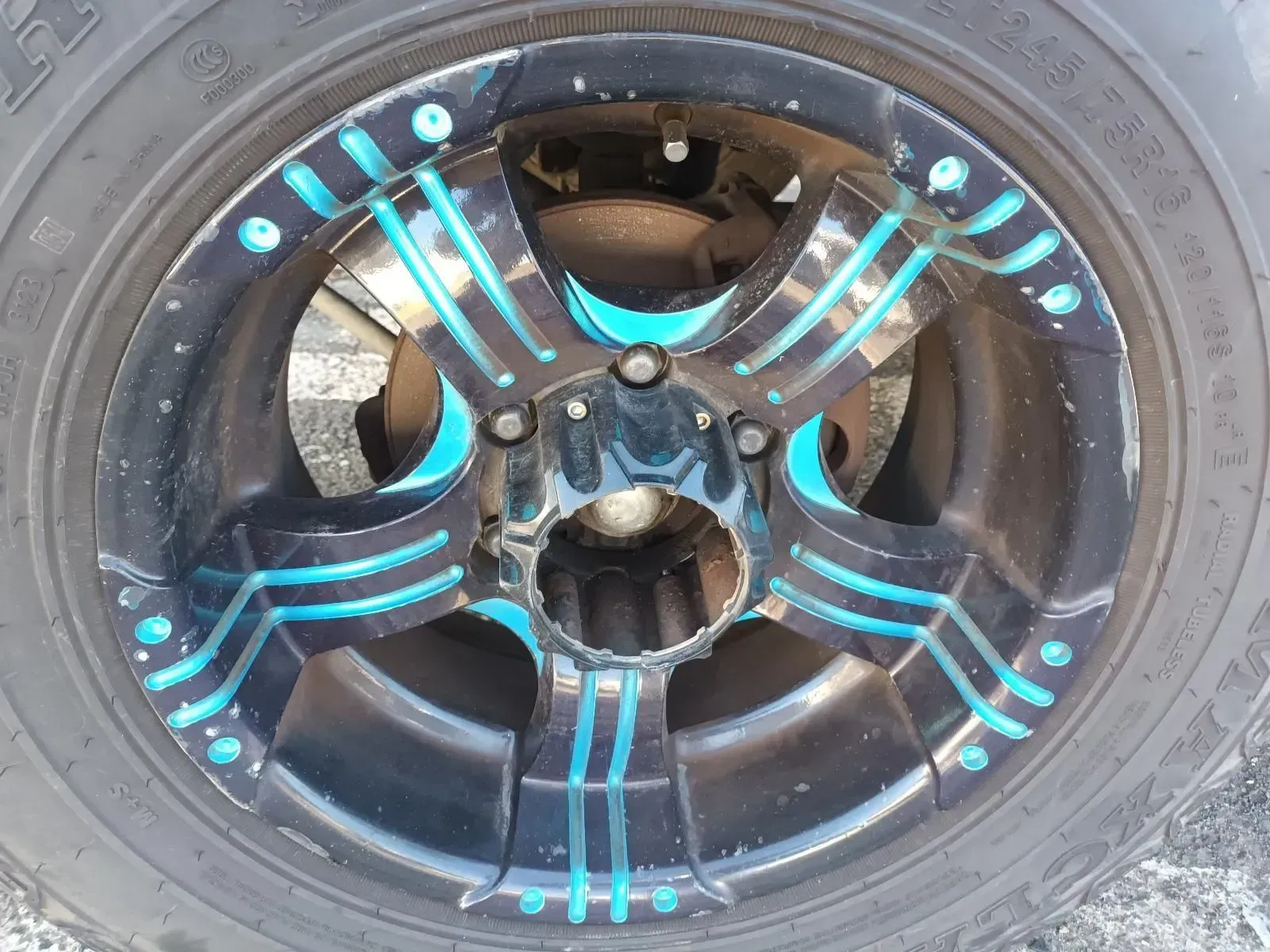Black and Blue Alloy Wheel on a Tyre — South West 4WD Wreckers In Brisbane, QLD