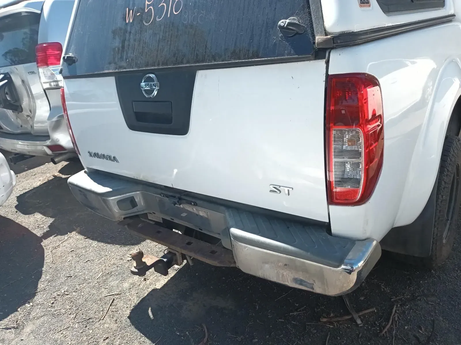 White Nissan Navara Truck Rear, With a Canopy and Tow Bar at a Salvage Yard — South West 4WD Wreckers In Brisbane, QLD