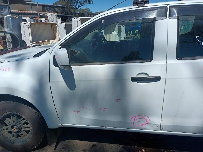 A White Truck With a Damaged Door is Parked on the Side of the Road — South West 4WD Wreckers In Brisbane, QLD