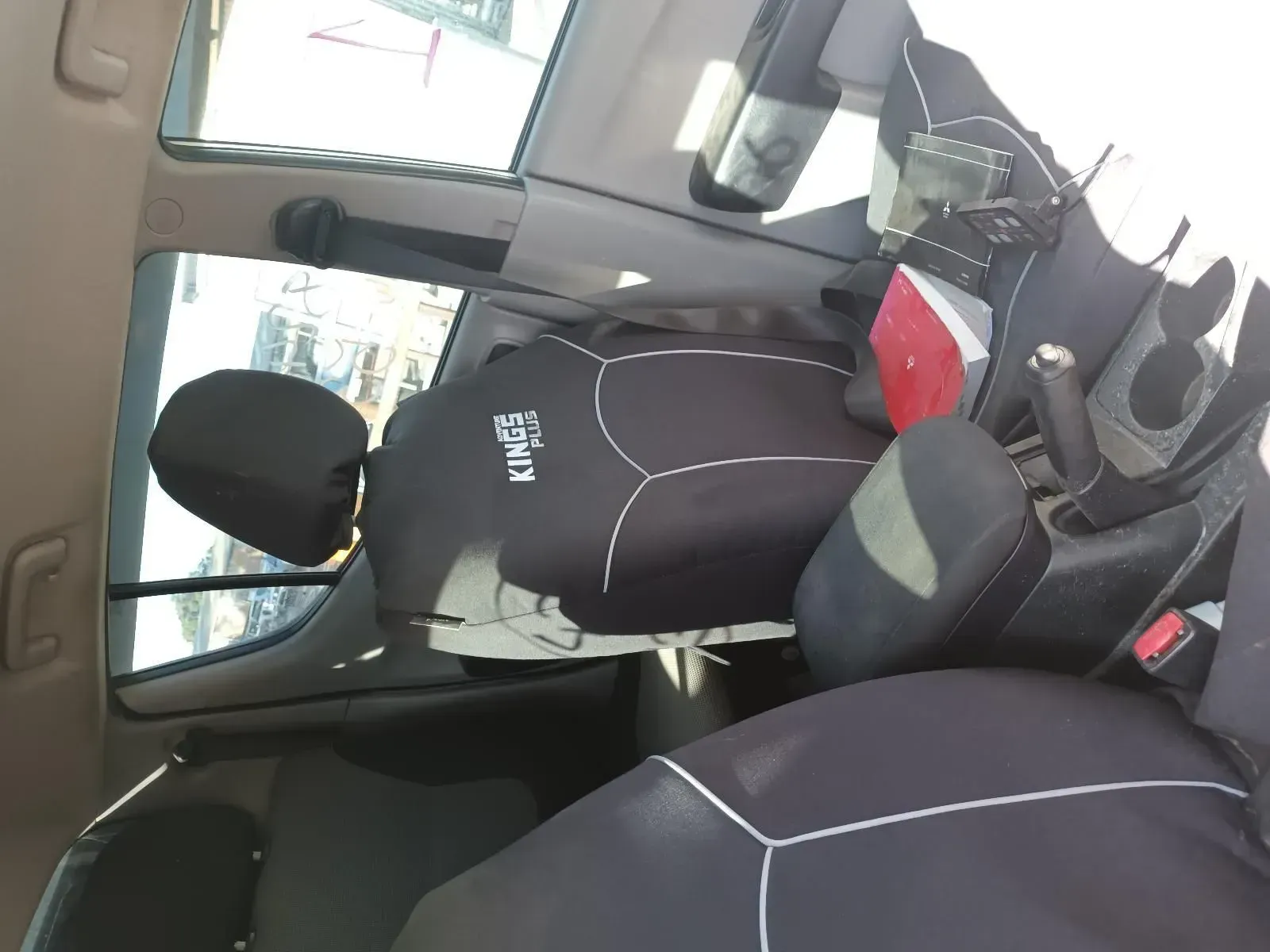 Interior of a Car Showing a Car Seat, Black Seat Covers, and the Rear Window — South West 4WD Wreckers In Brisbane, QLD