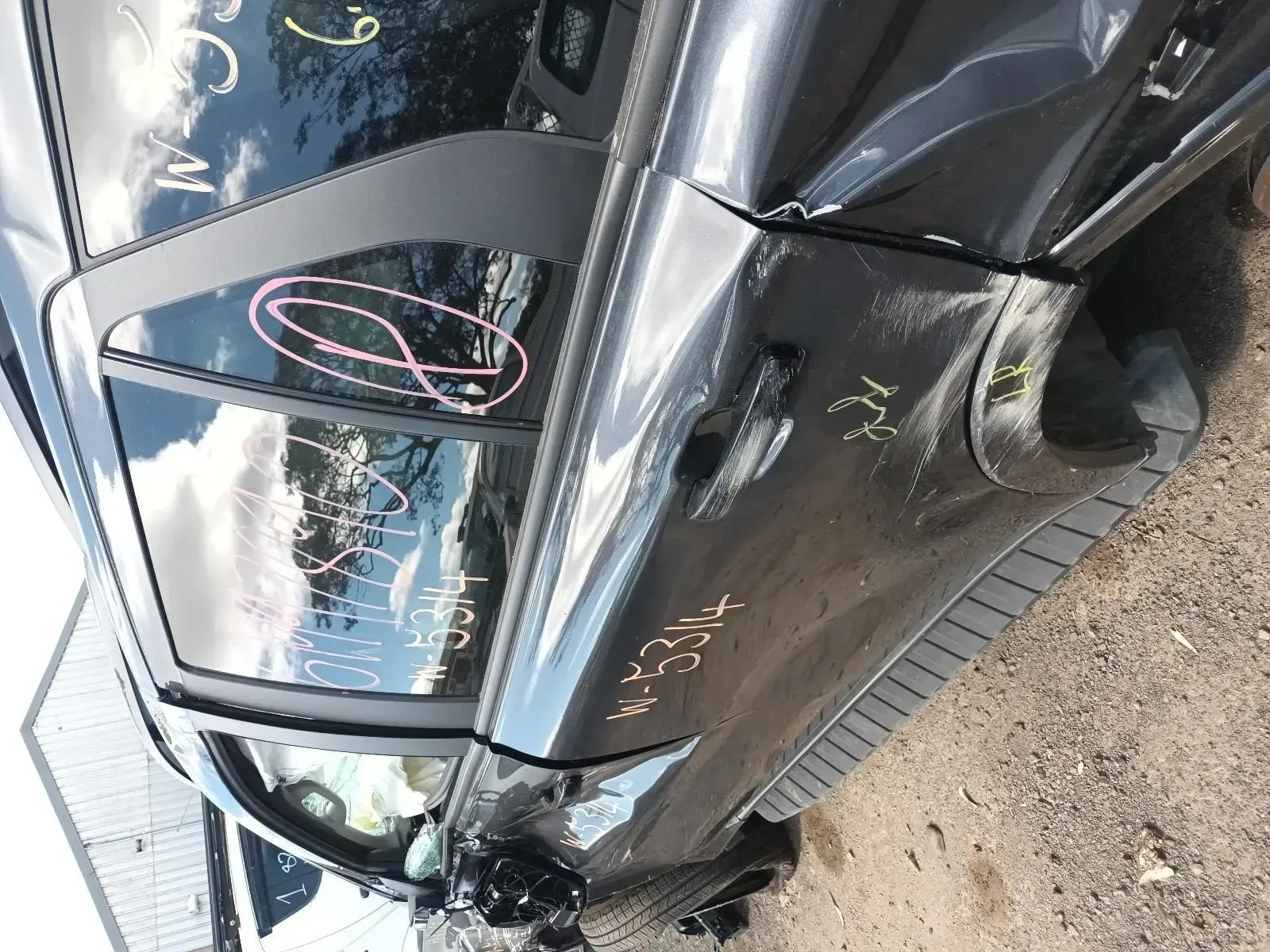 Damaged Black Car at a Salvage Yard — South West 4WD Wreckers In Brisbane, QLD