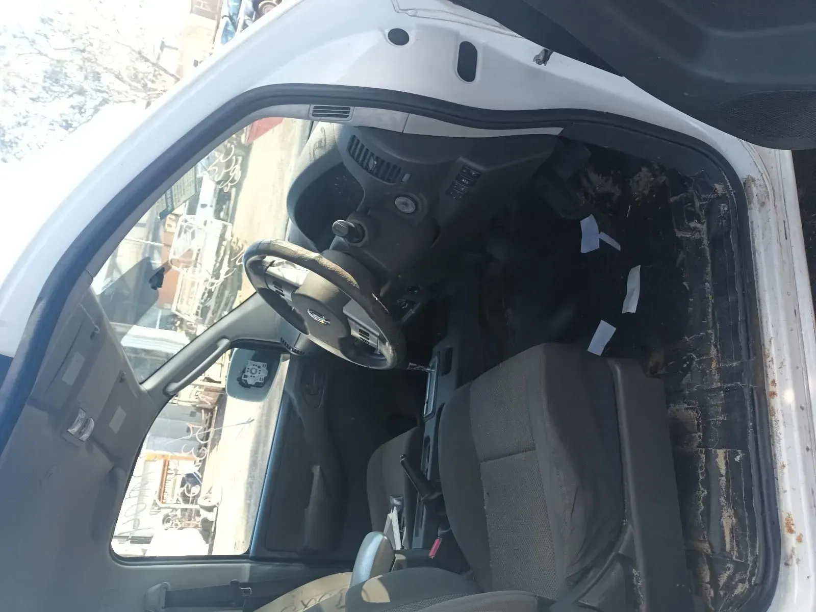 Interior of a White Vehicle With Steering Wheel and Seats Visible — South West 4WD Wreckers In Brisbane, QLD