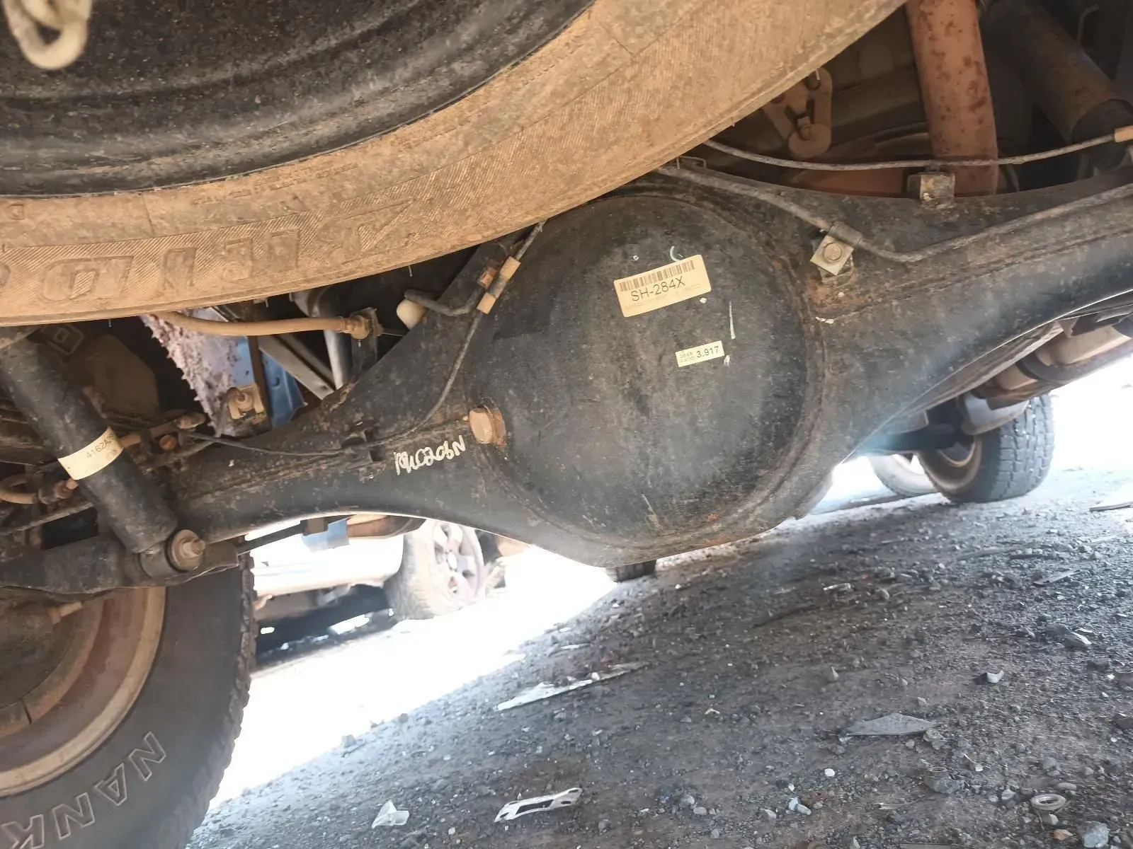 Underside of a Vehicle Showing the Rear Axle, Differential, and Spare Tyre — South West 4WD Wreckers In Brisbane, QLD