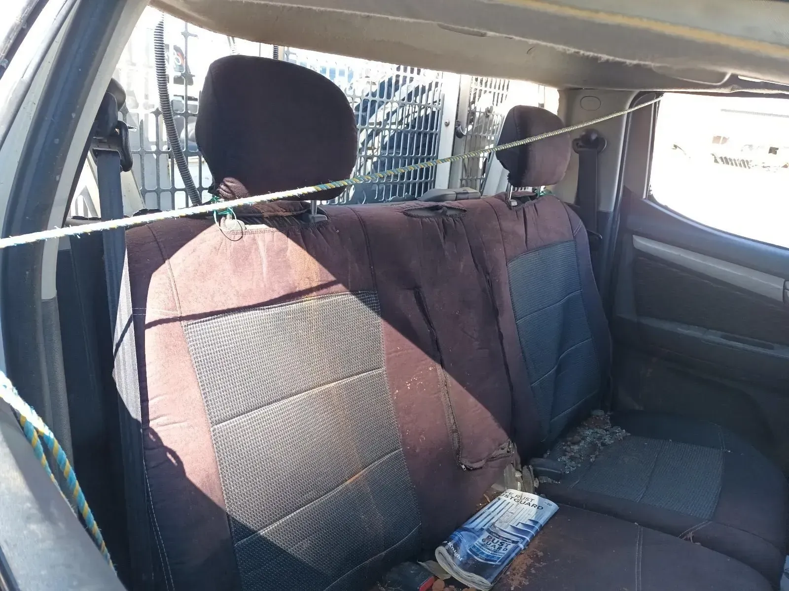 Backseat of a Car With Worn, Brown Fabric Seats — South West 4WD Wreckers In Brisbane, QLD