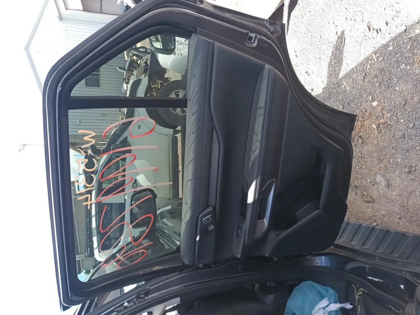 Black Car Door With Window Open, Revealing Interior Details, in an Outdoor Setting — South West 4WD Wreckers In Brisbane, QLD