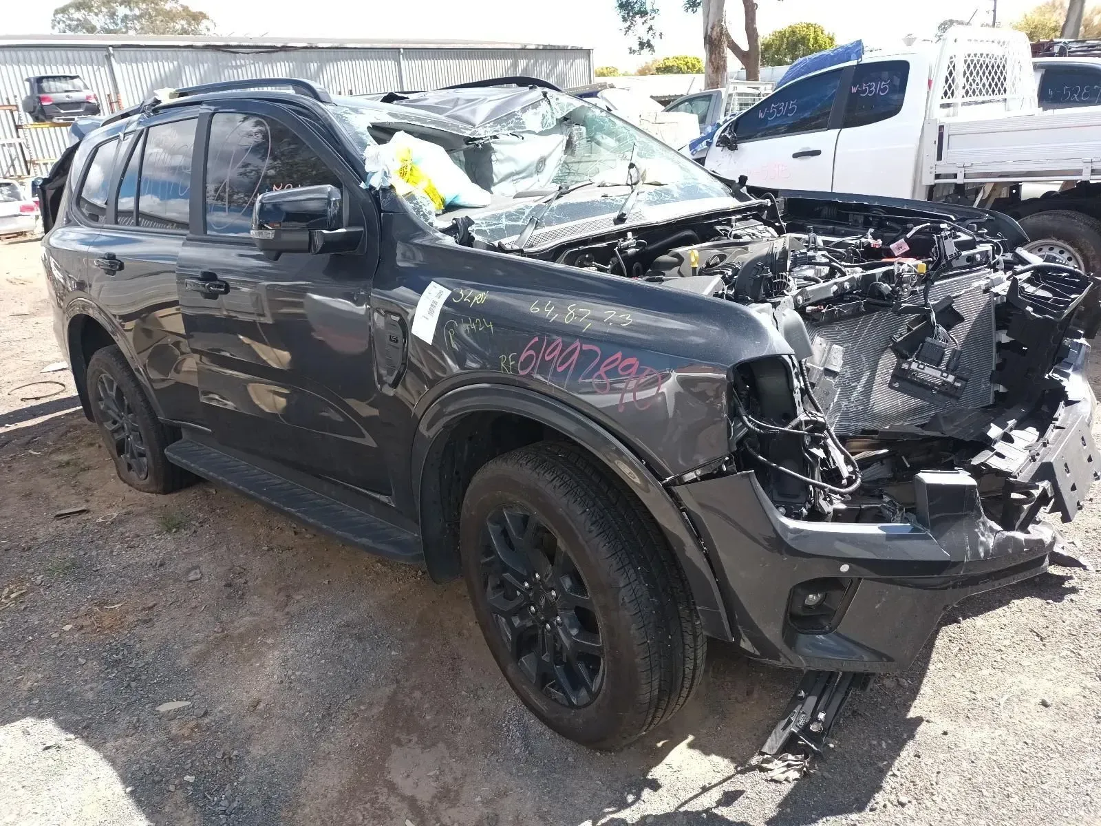 Damaged Dark Suv at a Salvage Yard — South West 4WD Wreckers In Brisbane, QLD