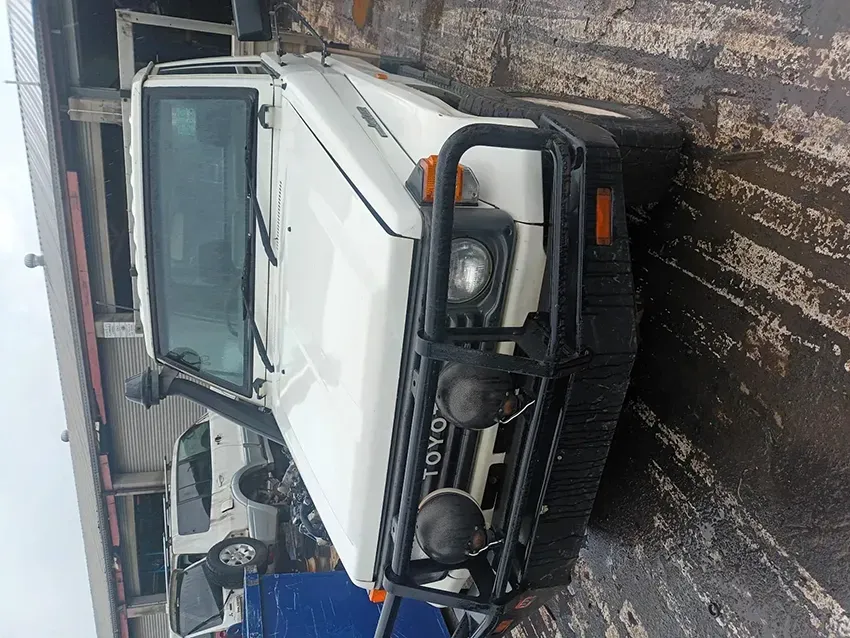 A White Toyota Truck is Parked in a Parking Lot — South West 4WD Wreckers In Brisbane, QLD