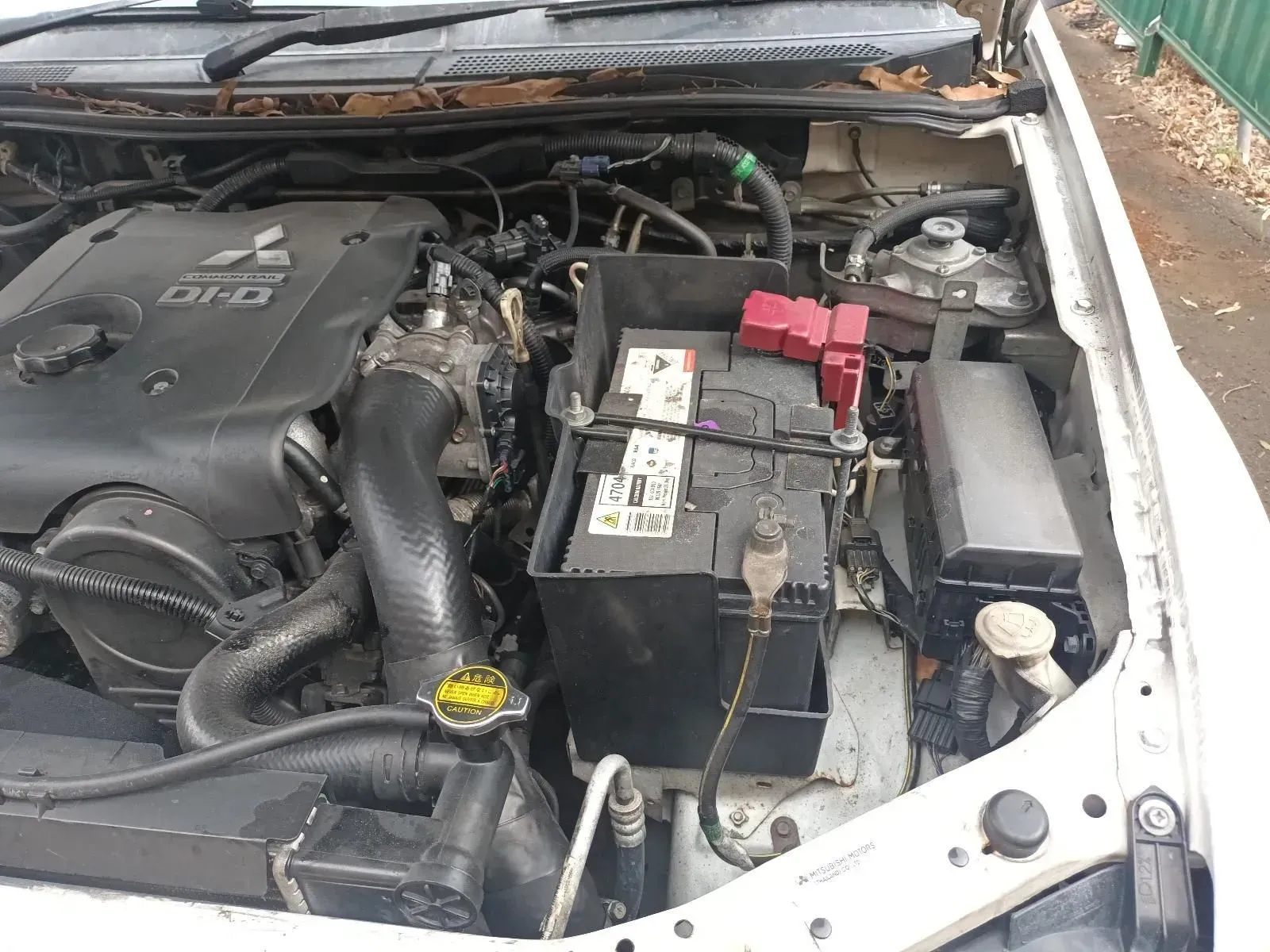 Engine Compartment of a White Mitsubishi Triton — South West 4WD Wreckers In Brisbane, QLD