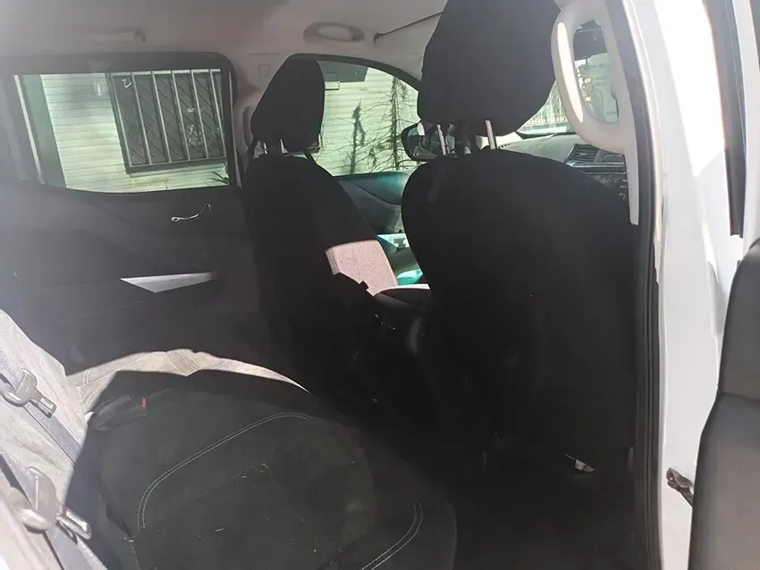 The Back Seat of a White Car with a Backpack in It — South West 4WD Wreckers In Brisbane, QLD
