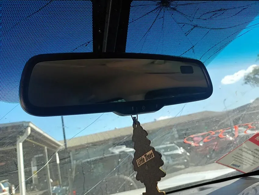The Rear View Mirror of a Car with a Tree Hanging from It — South West 4WD Wreckers In Brisbane, QLD