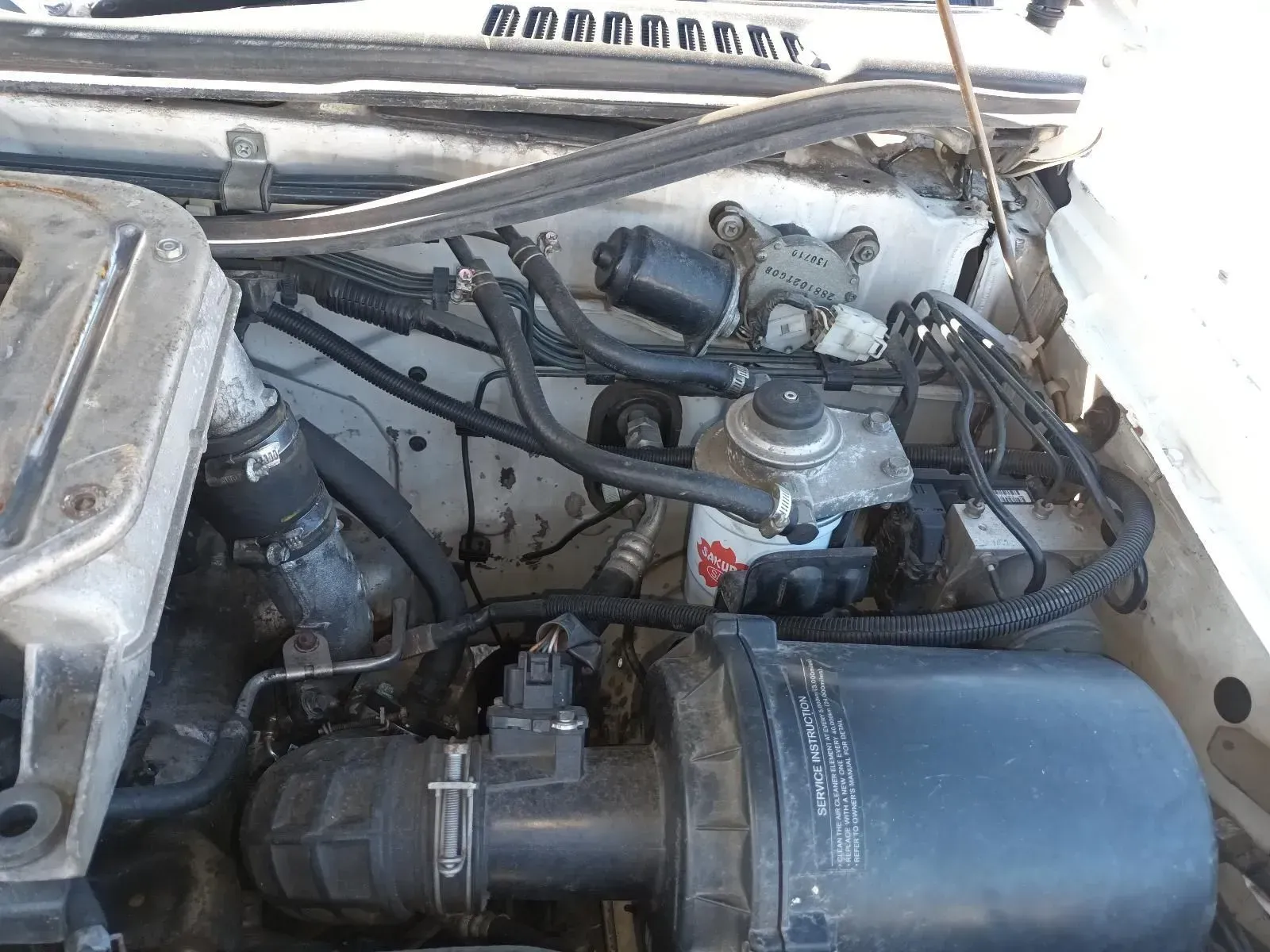 Engine Compartment With Various Black Hoses, Components, and Air Filter — South West 4WD Wreckers In Brisbane, QLD