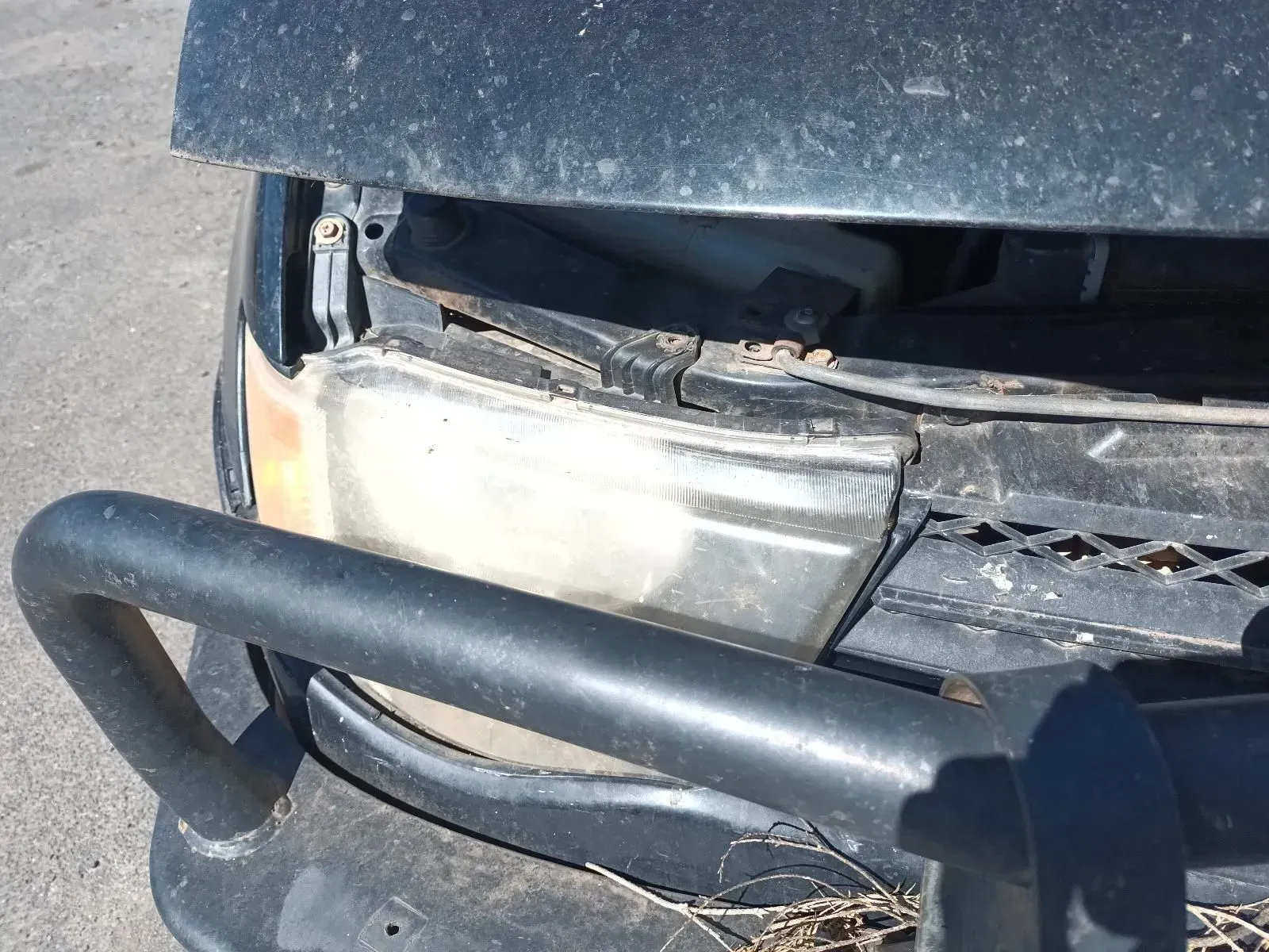 Front End of a Black Vehicle With a Damaged Headlight and Bull Bar — South West 4WD Wreckers In Brisbane, QLD