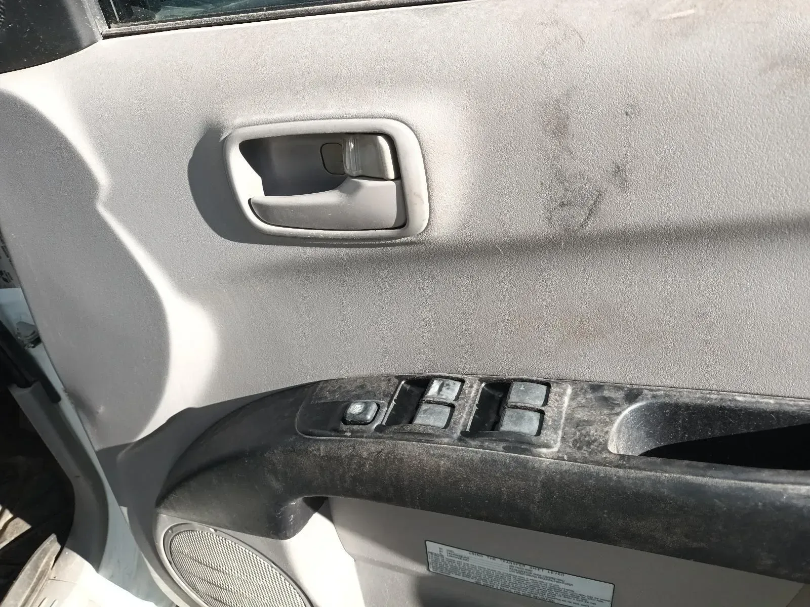 Gray, Dirty Car Door Panel With Handle, Window Controls, and Speaker — South West 4WD Wreckers In Brisbane, QLD
