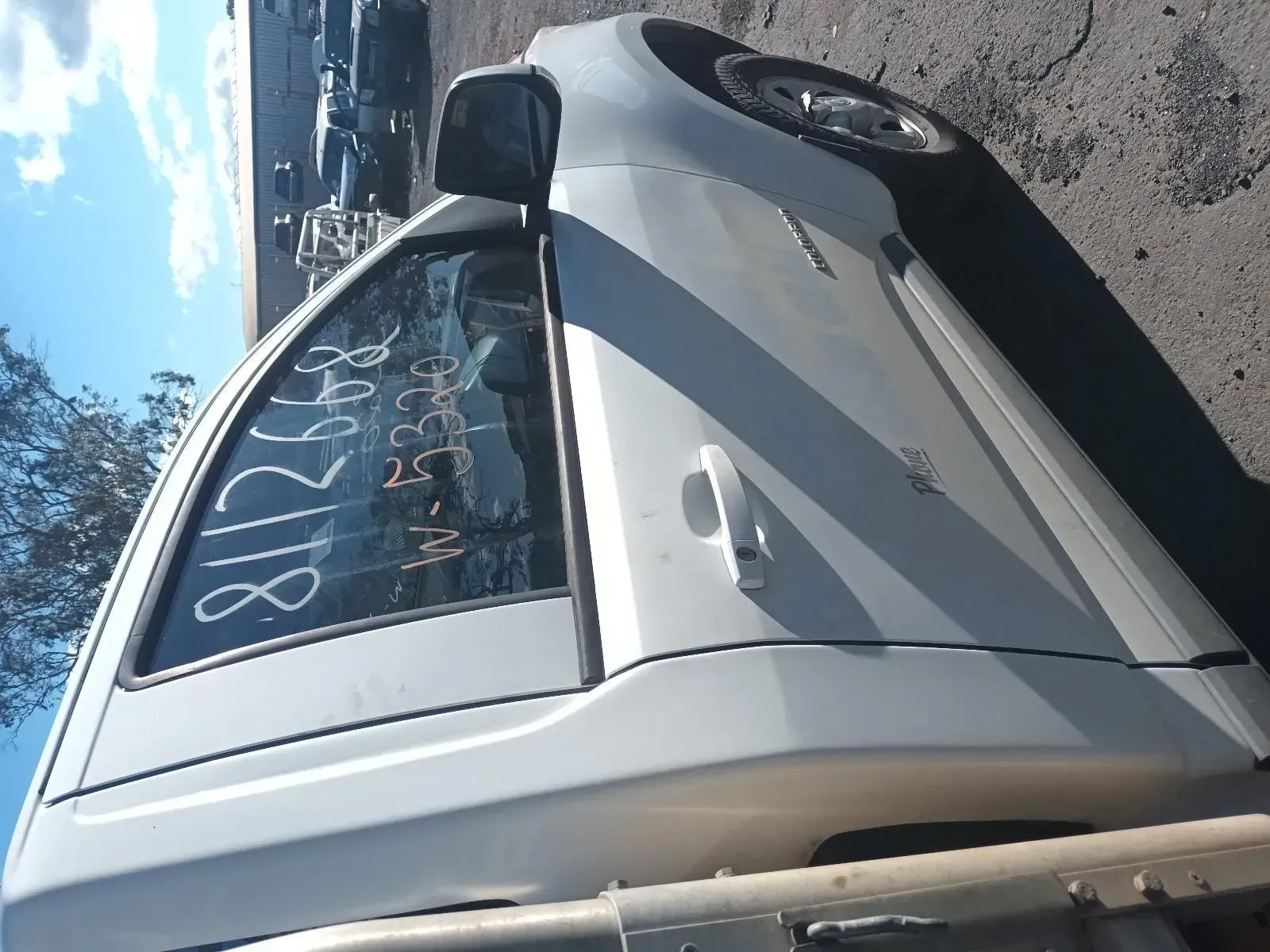 White Car Door With Window, Mirror, and Handle in a Salvage Yard, Sunny Day — South West 4WD Wreckers In Brisbane, QLD