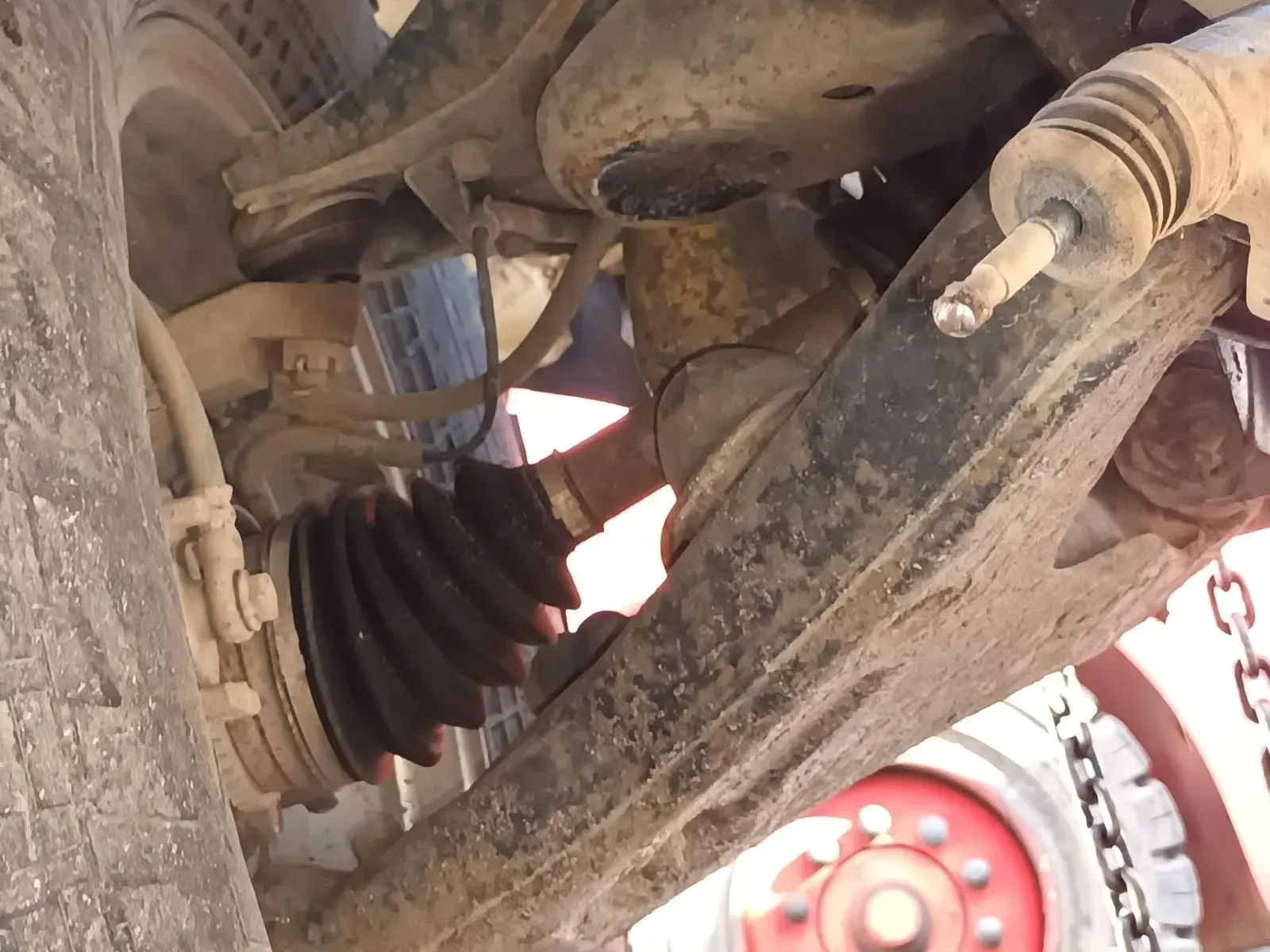 Undercarriage View of a Dirty Vehicle's Wheel and Suspension Components — South West 4WD Wreckers In Brisbane, QLD
