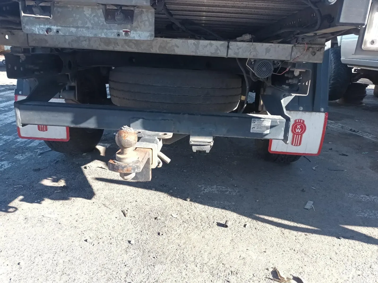 Rear of a Kenworth Truck, Spare Tyre, Tow Hitch, and Mud Flaps — South West 4WD Wreckers In Brisbane, QLD