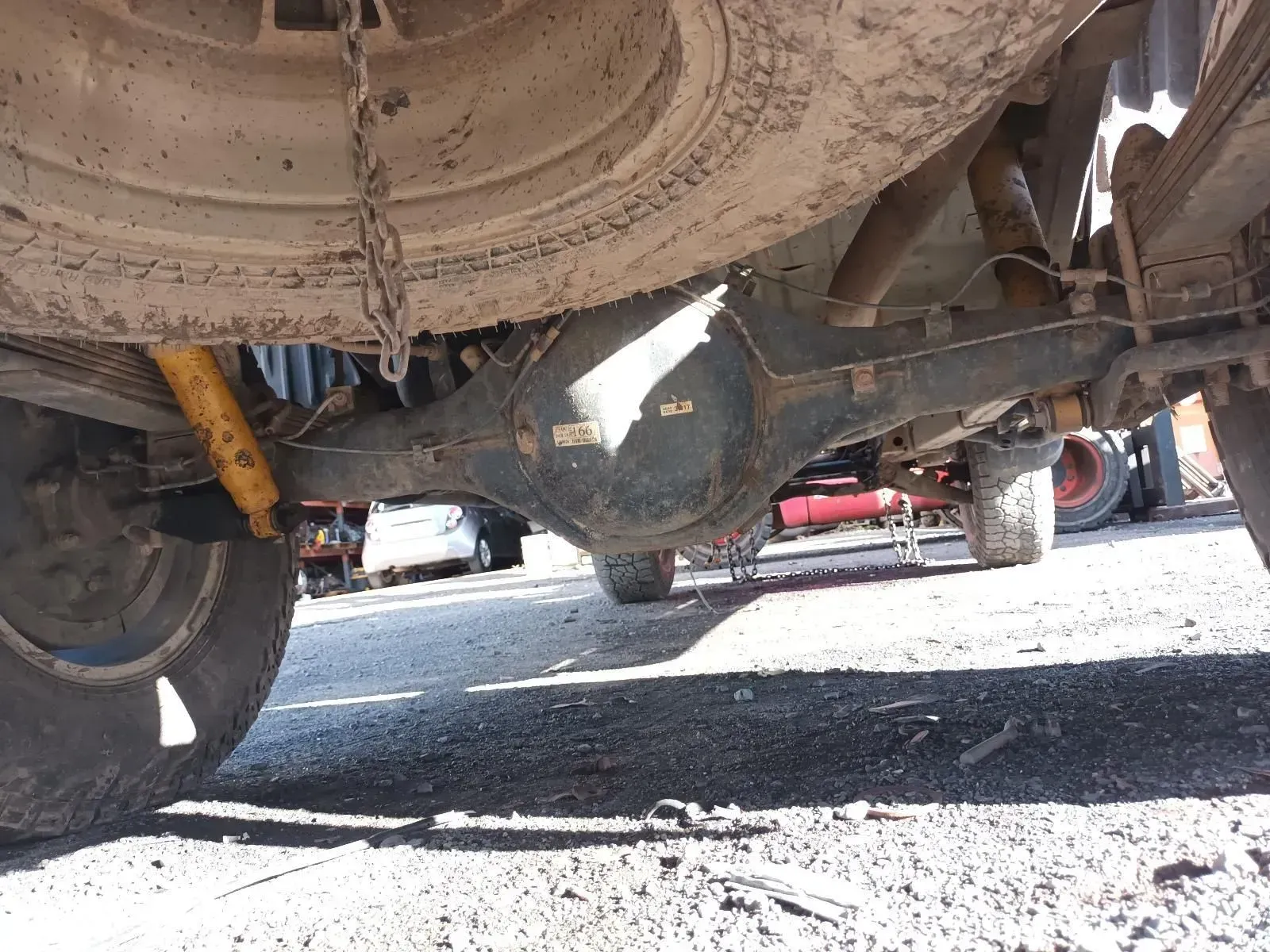 Underside of a Vehicle Showing the Rear Axle, Spare Tyre, and Suspension — South West 4WD Wreckers In Brisbane, QLD