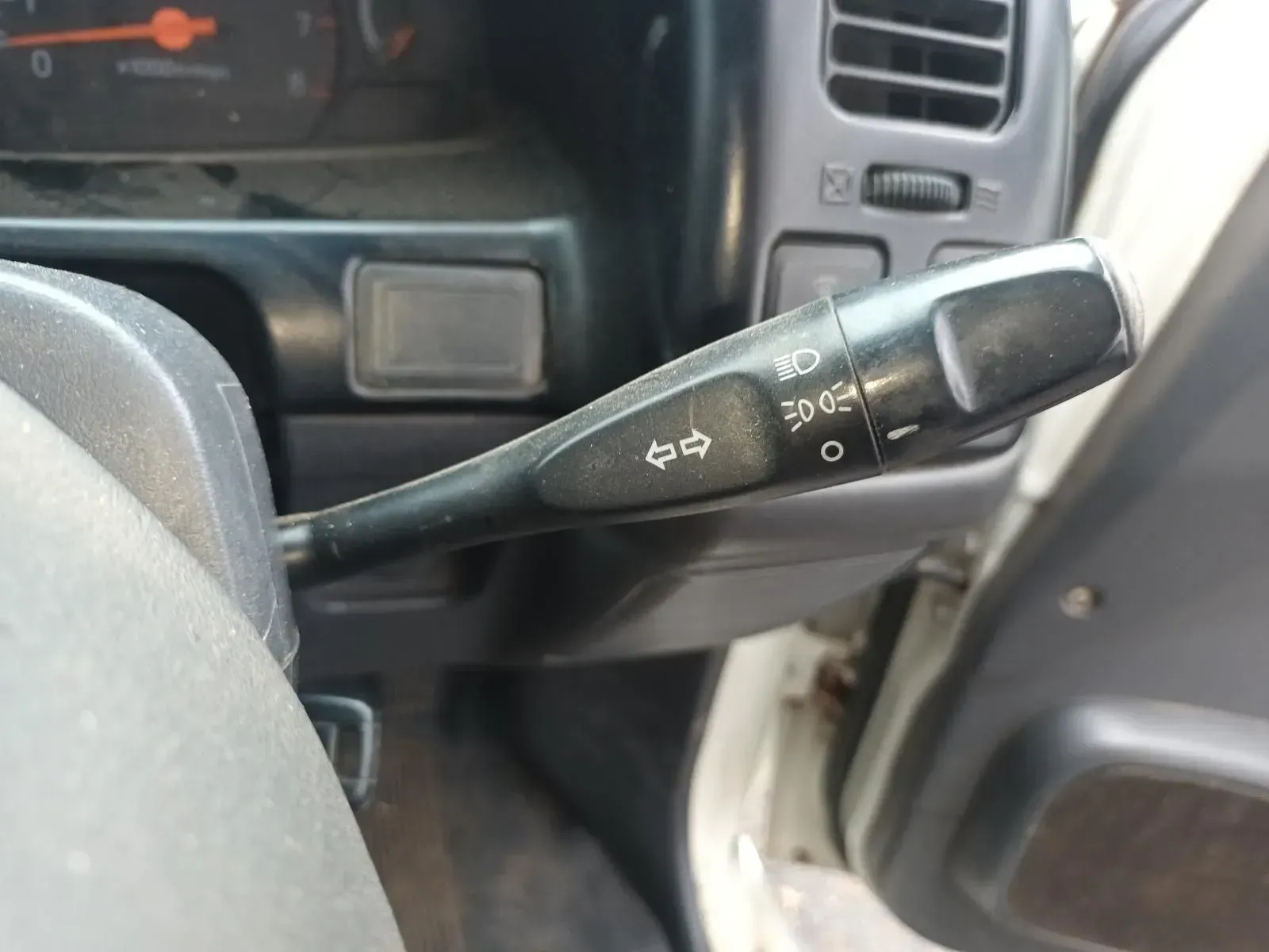 Steering Wheel Lever With Symbols for Lights and Turn Signals Inside a Vehicle — South West 4WD Wreckers In Brisbane, QLD