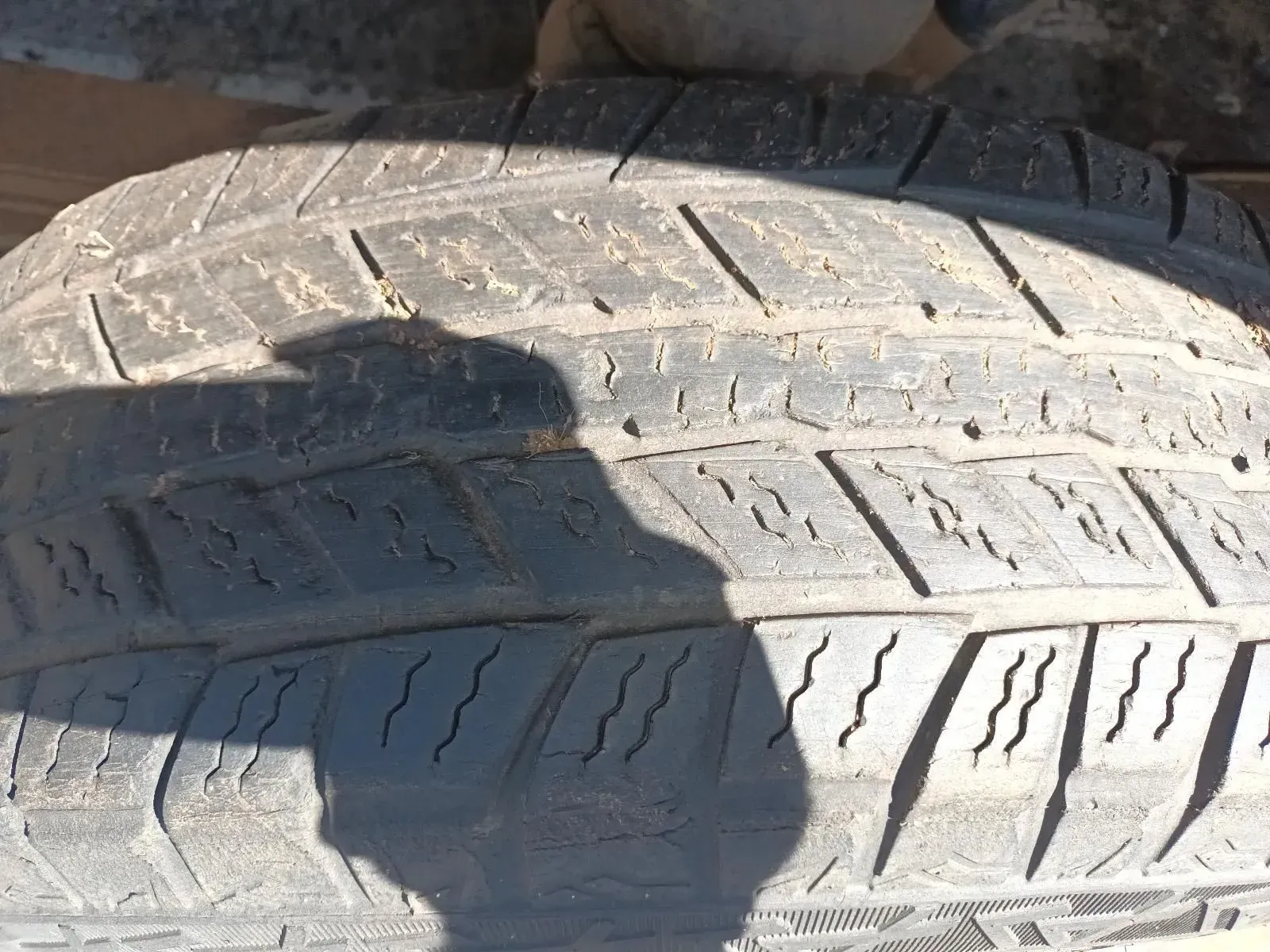 Close-up of a Worn Tyre Tread With Visible Wear and Debris on It — South West 4WD Wreckers In Brisbane, QLD