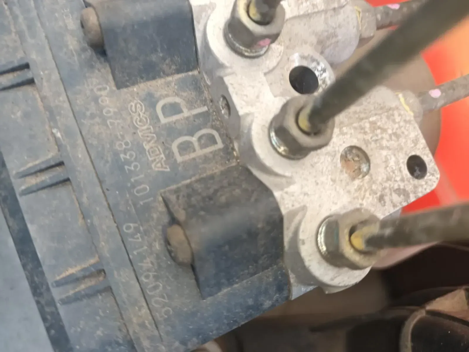 Close-up of a Car's ABS Module With Attached Brake Lines — South West 4WD Wreckers In Brisbane, QLD