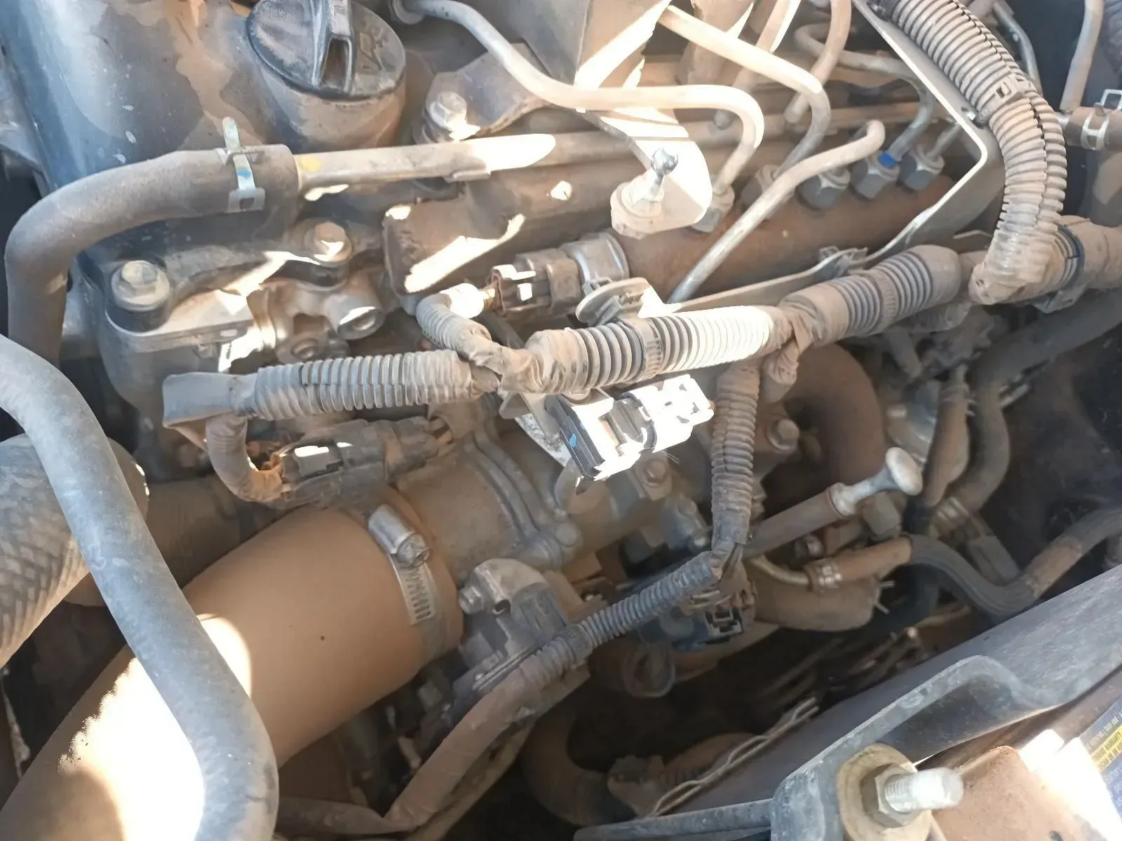 Dirty Engine Bay With Hoses, Wires, and Components, Possibly a Vehicle's Engine — South West 4WD Wreckers In Brisbane, QLD